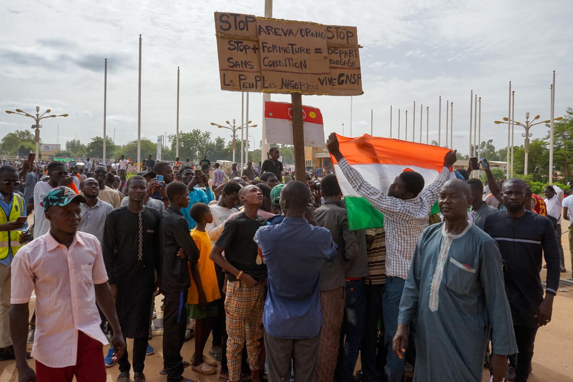 Supporters of the military display a sign that reads 'Stop Areva/Orano, Get out', during a rally in Niamey, Niger, 06 August 2023, (issued 07 August 2023). EFE/EPA/ISSIFOU DJIBO