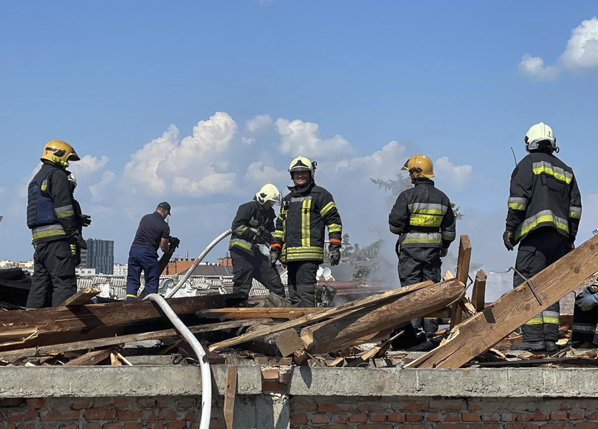 A handout photo made available by the State Emergency Service of Ukraine shows rescuers working at the area where a missile hit the Drama Theatre downtown of Chernihiv, Ukraine, 19 August 2023. EFE/EPA/STATE EMERGENCY SERVICE OF UKRAINE HANDOUT HANDOUT EDITORIAL USE ONLY/NO SALES
