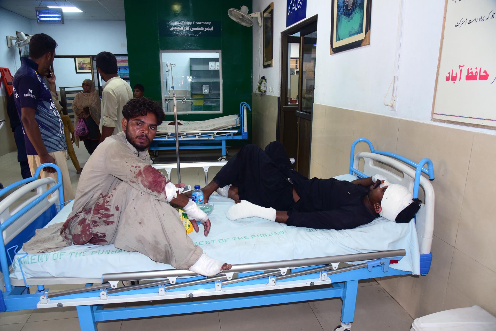 People who were injured in a bus accident receive treatment at a hospital in Pindi Bhattian, Pakistan, 20 August 2023. EFE/EPA/ISRAR UL HAQ

