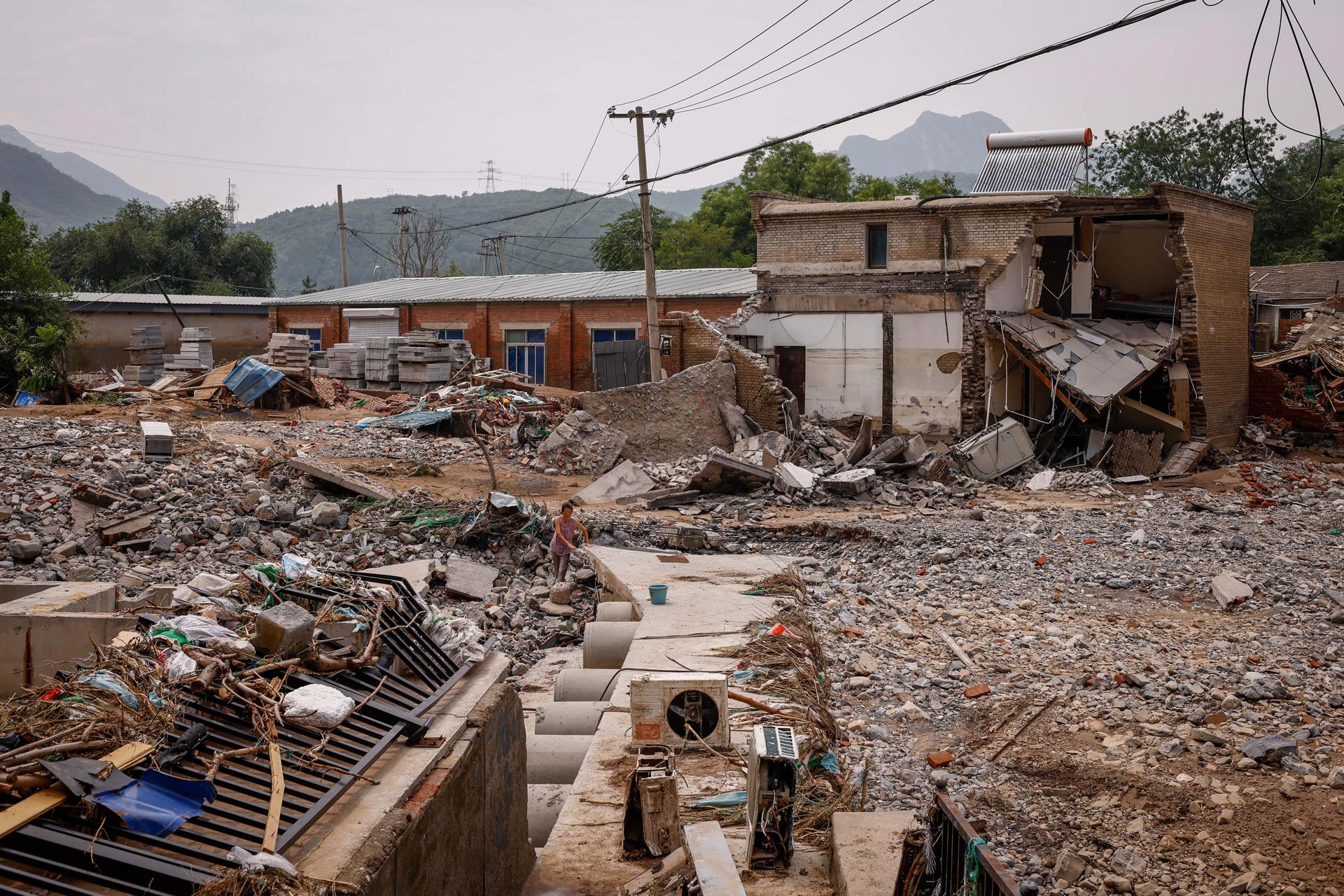 A view on damaged structures following strong rains and floods at a village in the mountains of Mentougou District, west of Beijing, China, 04 August 2023. EFE-EPA/MARK R. CRISTINO
