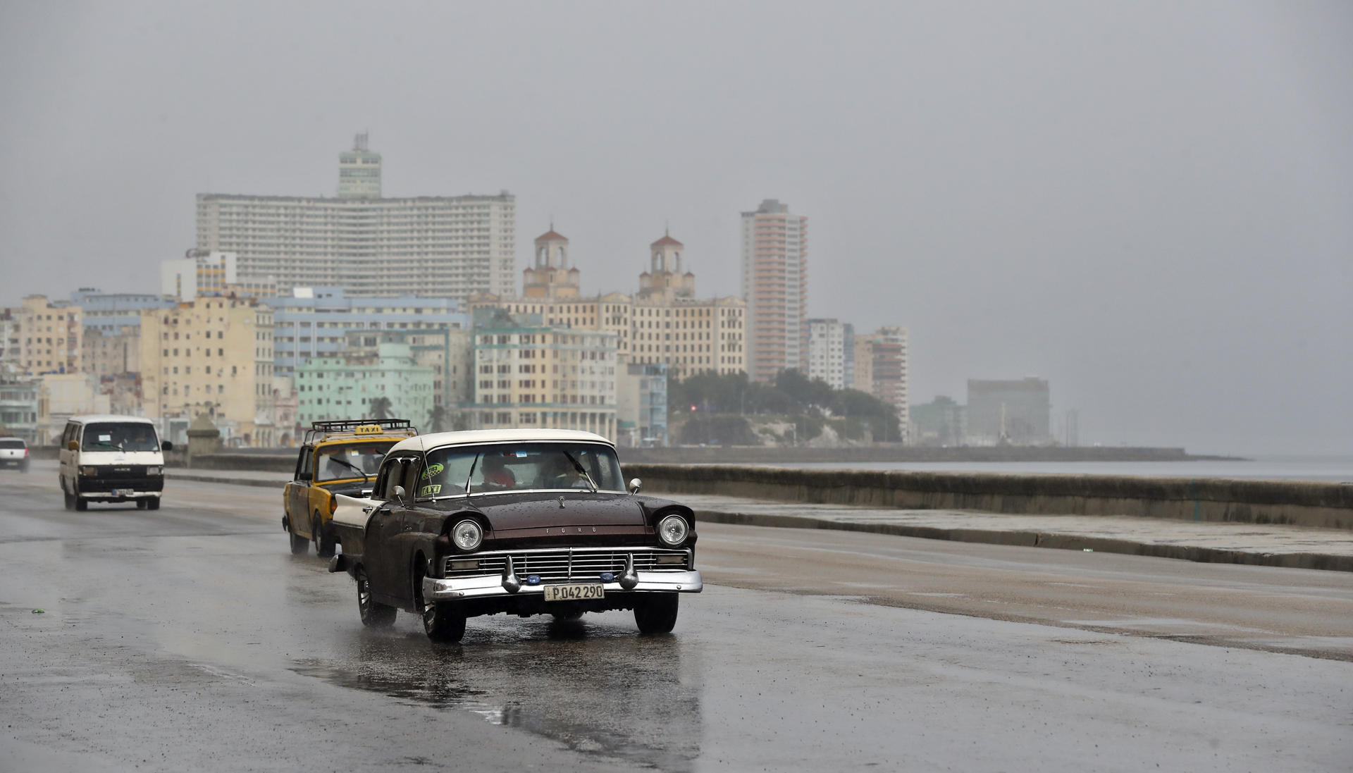 People drive vehicles in the rain, at the Malecon in Havana, Cuba, 28 August 2023. EFE-EPA/Ernesto Mastrascusa
