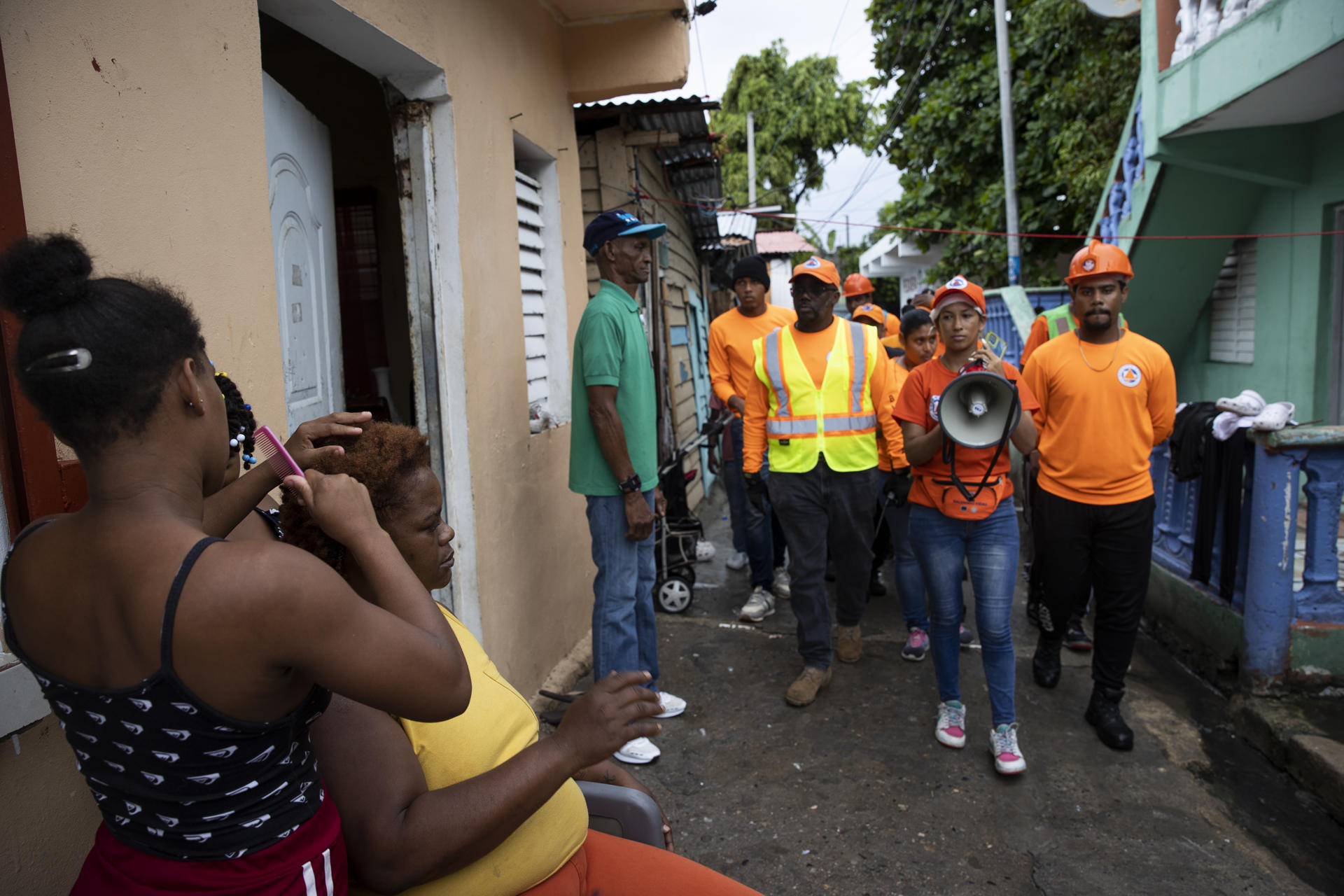 Members of the Civil Defense tour a neighborhood urging the population to exercise caution in the face of the imminent arrival of tropical storm Franklin, in Haina, Dominican Republic 22 August 2023. EFE/Orlando Barria