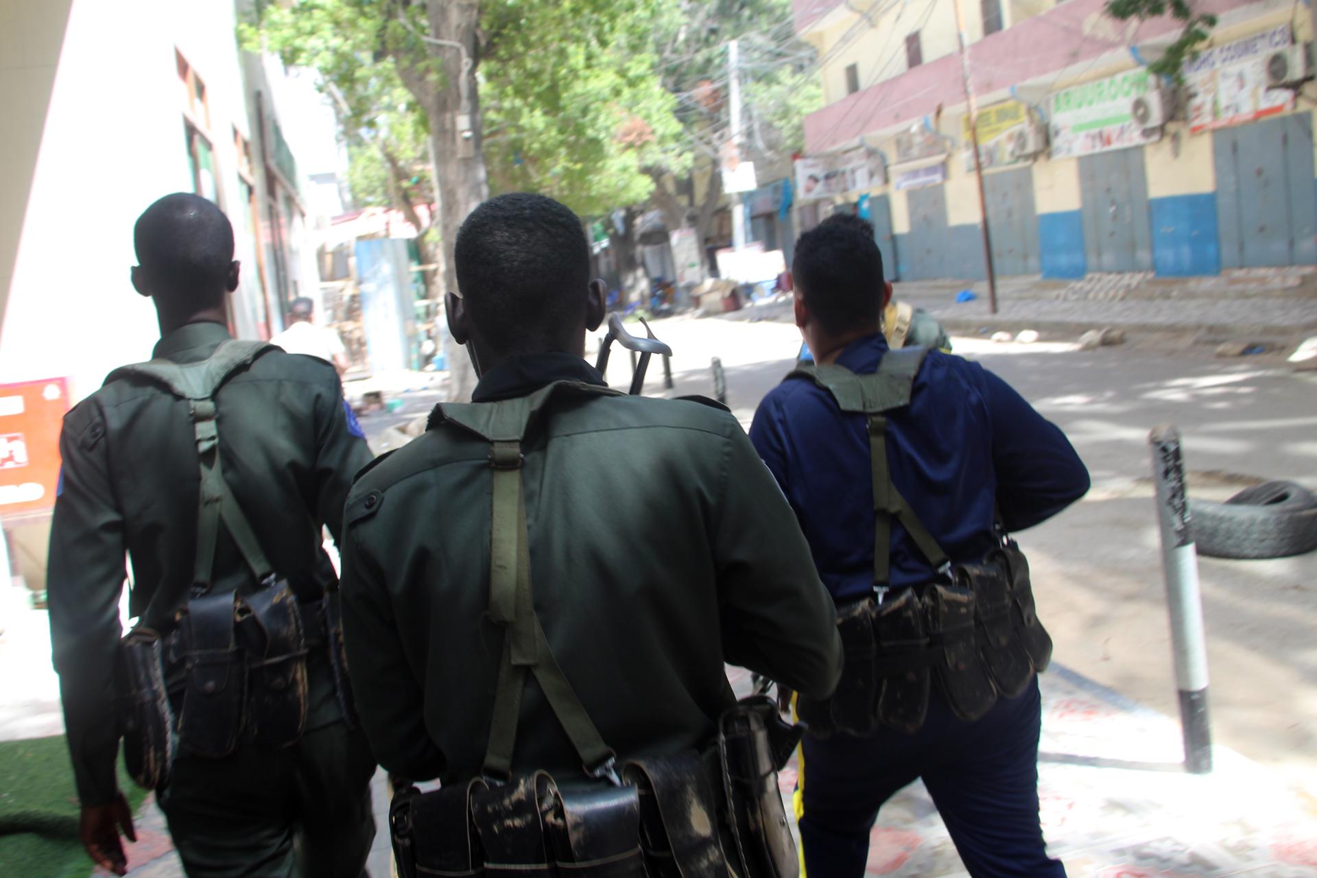 A file picture shows Somali policemen patrolling a street in Mogadishu, Somalia. EFE/EPA/FILE/SAID YUSUF WARSAME