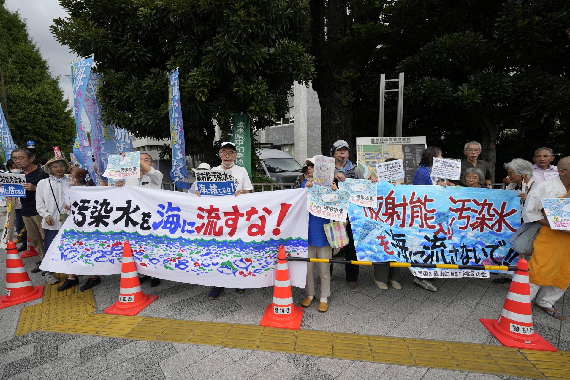 Protesters hold banners reading 'Don't discharge contaminated water into the sea!' during a rally in front of the Prime Minister's official residence as Prime Minister Fumio Kishida was holding a ministerial meeting about the release of treated water from the crippled Fukushima nuclear power plant into the sea, in Tokyo, Japan, 22 August 2023. EFE-EPA/FRANCK ROBICHON
