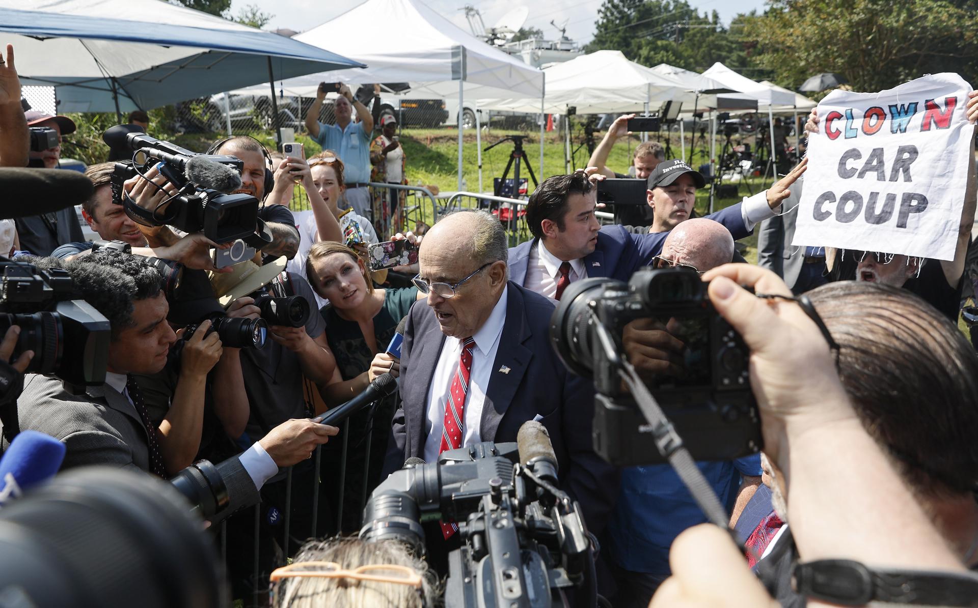 Former New York mayor and Donald Trump's personal attorney Rudy Giuliani (C) addresses reporters outside the Fulton County Jail following his surrender in Atlanta, Georgia, USA, 23 August 2023. (New York) EFE/EPA/ERIK S. LESSER

