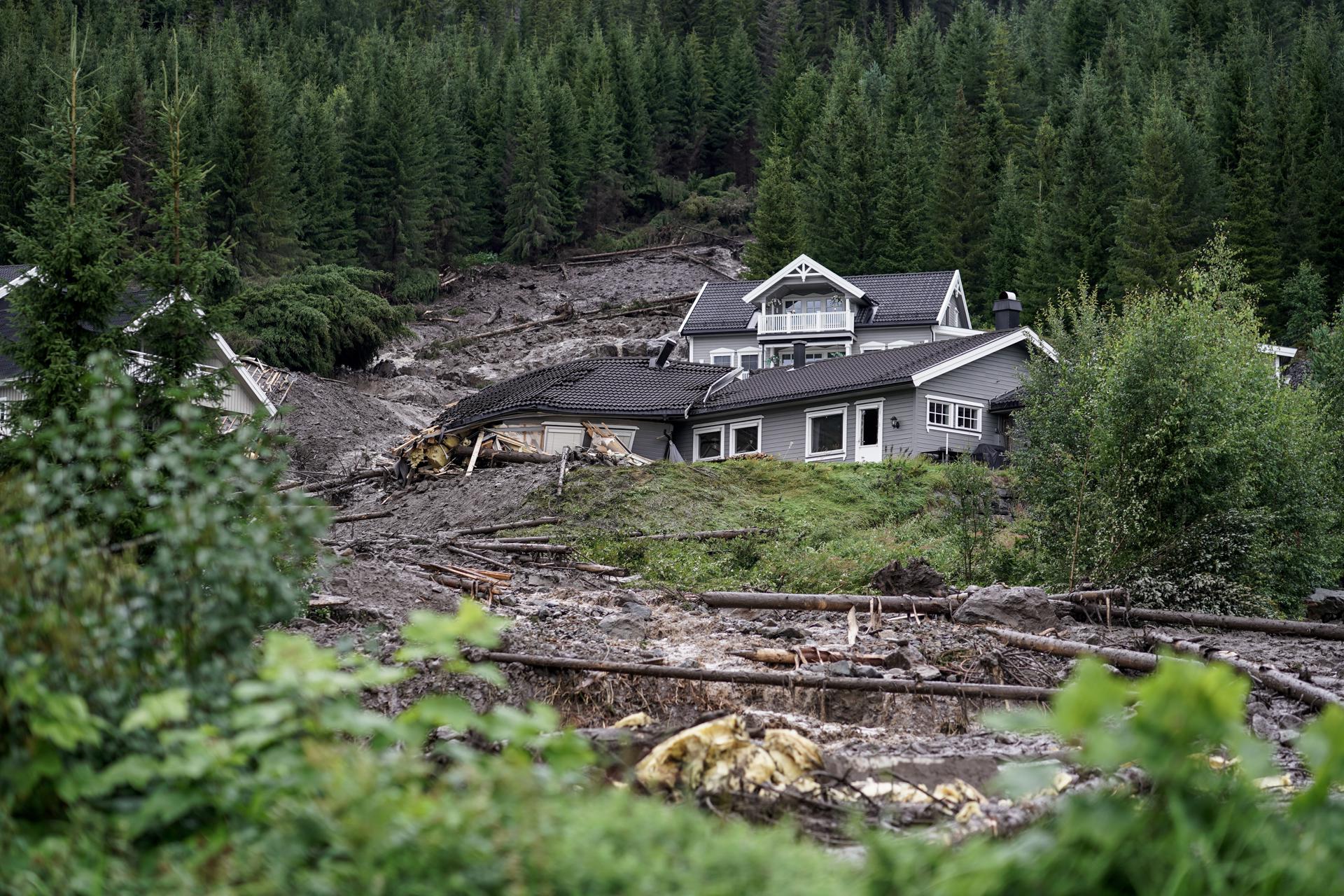 Mud and logs are washed down a slope hitting several residential buildings near Valdres, Nord Aurdal, Norway, 08 August 2023. EFE/EPA/Cornelius Poppe NORWAY OUT