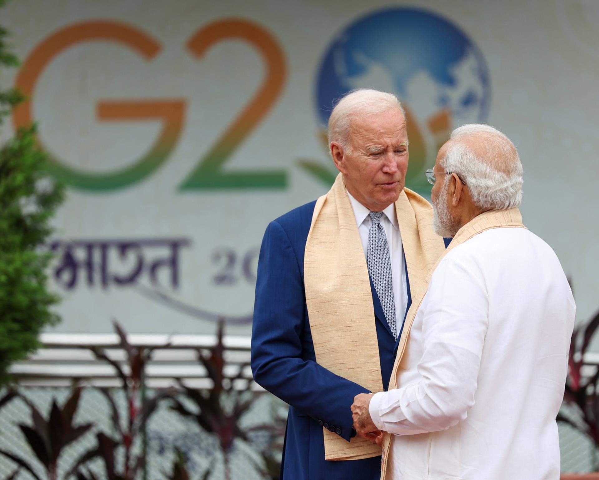 A handout photo made available by the Indian Press Information Bureau (PIB) shows shows Indian Prime Minister Narendra Modi (R) welcoming US President Jo Biden (C) upon his arrival at the Mahatma Gandhi's memorial in Rajghat, New Delhi, India 10 September 2023. EFE/EPA/INDIA PRESS INFORMATION BUREAU HANDOUT EDITORIAL USE ONLY/NO SALES