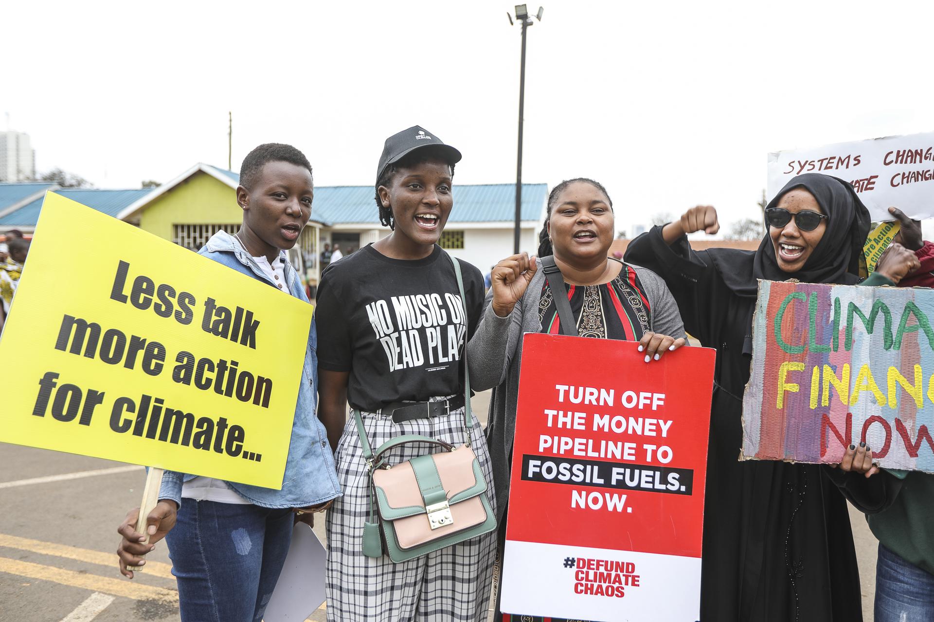 Climate activists including Ugandan activist Venessa Nakate (2-L) hold placards and shout slogans during a march in Nairobi, Kenya, 04 September 2023. EFE-EPA FILE/Daniel Irungu
