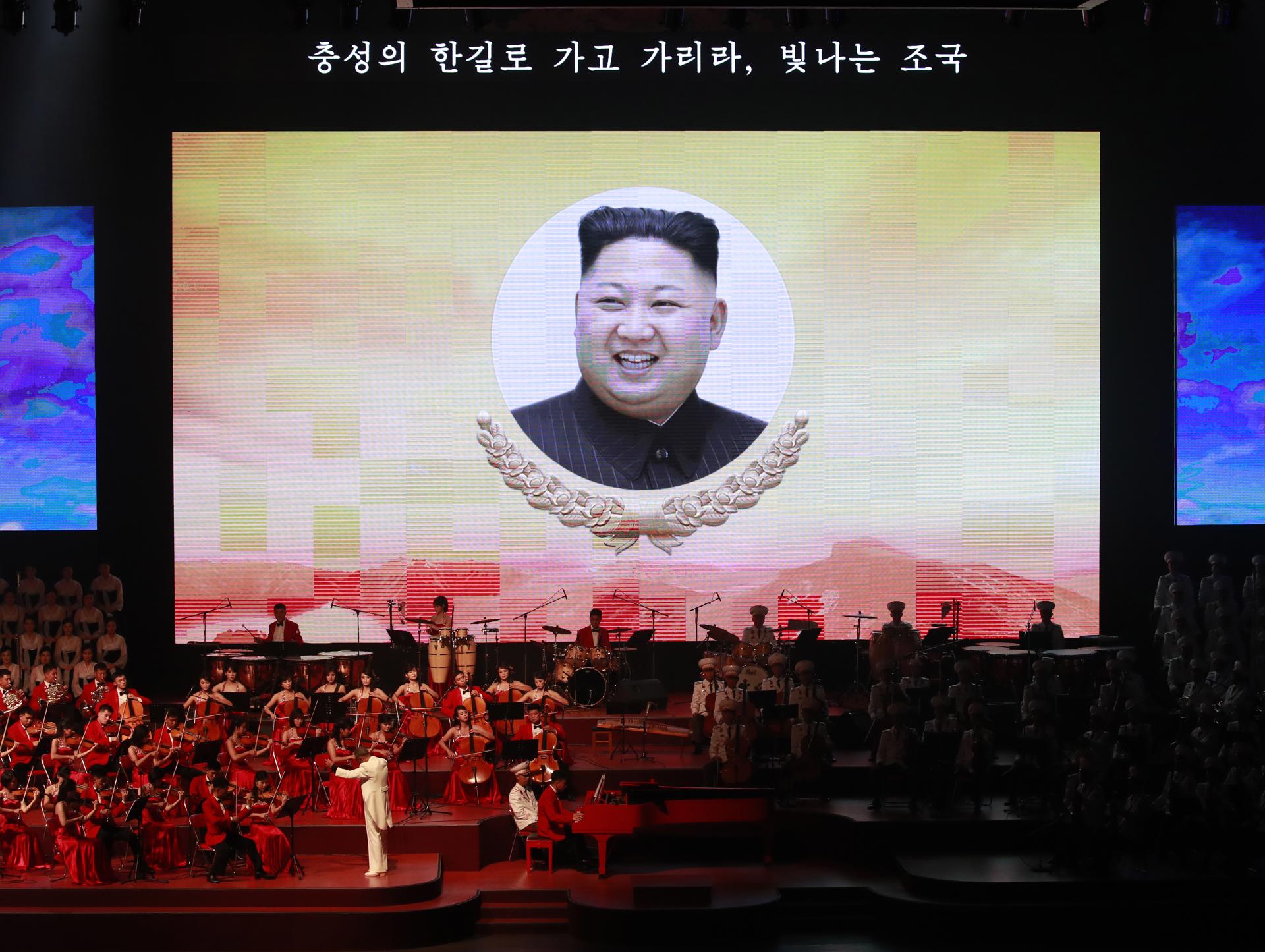North Korean leader Kim Jong-un is projected on a screen as orchestra musicians perform during a concert celebrating the 70th anniversary of its Founding in Pyongyang, North Korea, 08 September 2018. EFE-EPA FILE/HOW HWEE YOUNG
