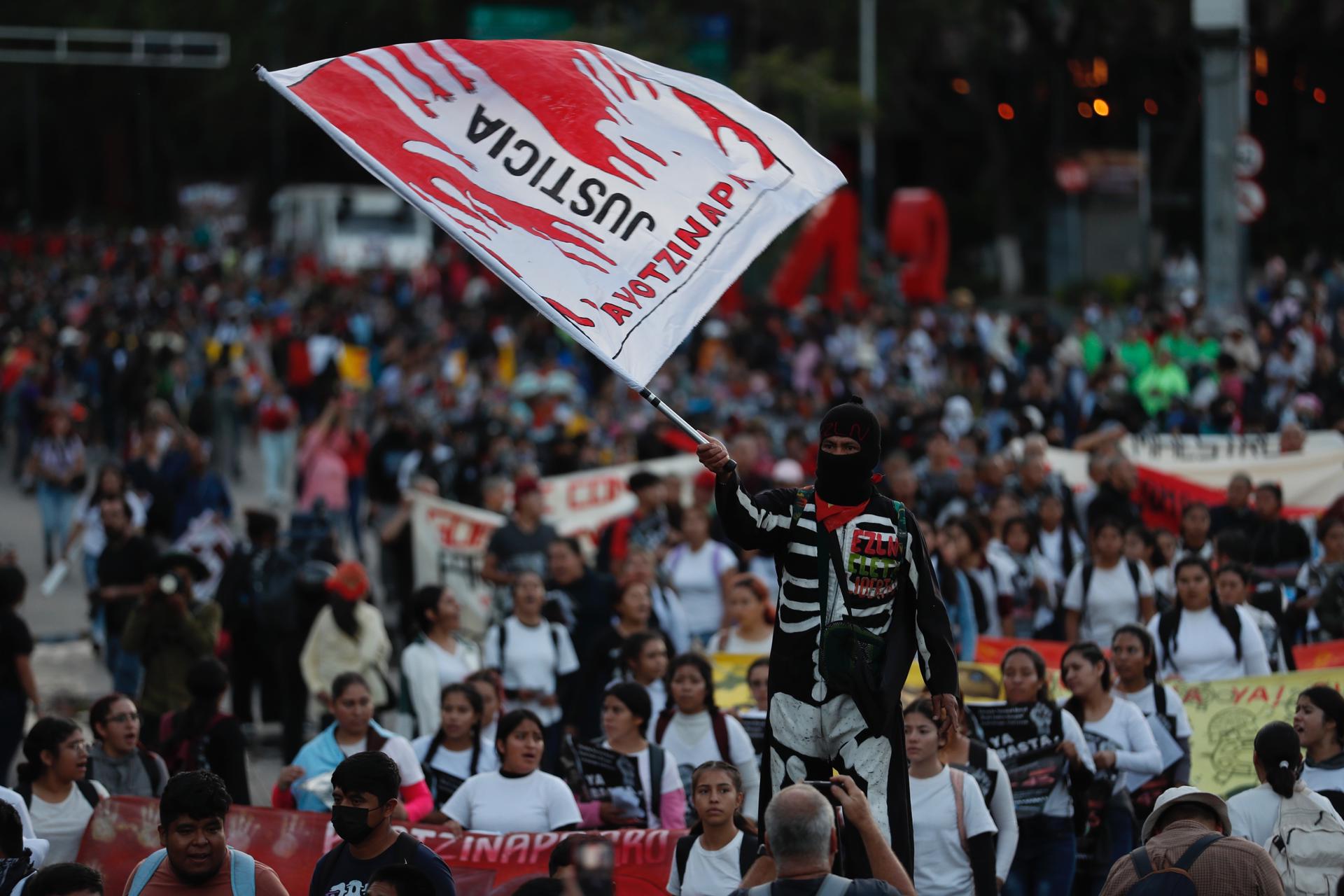 Fathers and mothers of the 43 young people who disappeared from Ayotzinapa in September 2014 and students from the rural school, located in the southern state of Guerrero, hold a massive demonstration to commemorate the ninth anniversary of the 43 missing Mexicans from Ayotzinapa, in Mexico City, Mexico, 26 Septemeber 2023. EFE-EPA/Sáshenka Gutiérrez
