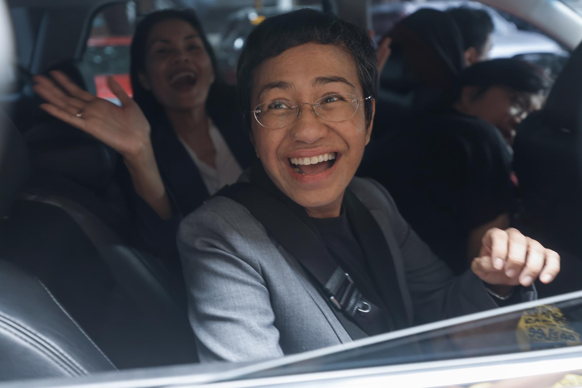 Nobel Peace Prize laureate Maria Ressa, the CEO of online news site Rappler, reacts from inside a vehicle outside the regional trial court in Pasig City, Metro Manila, Philippines, 12 September 2023. EFE-EPA/ROLEX DELA PENA