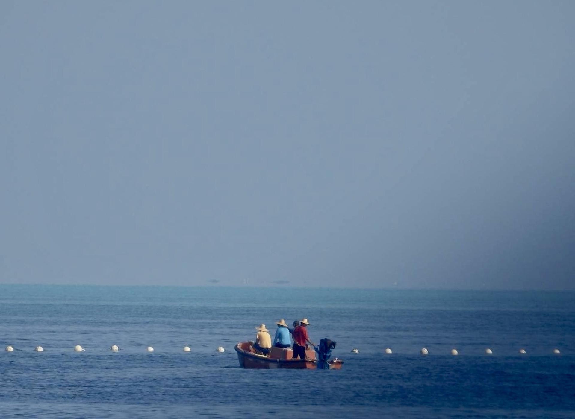 A handout photo made available by Philippine Coast Guard (PCG) shows Chinese Coast Guard boats patrolling next to a floating barrier at the vicinity of Scarborough Shoal in the disputed South China Sea on 20 September 2023 (issued on 25 September 2023). EFE/EPA/HO HANDOUT HANDOUT EDITORIAL USE ONLY/NO SALES