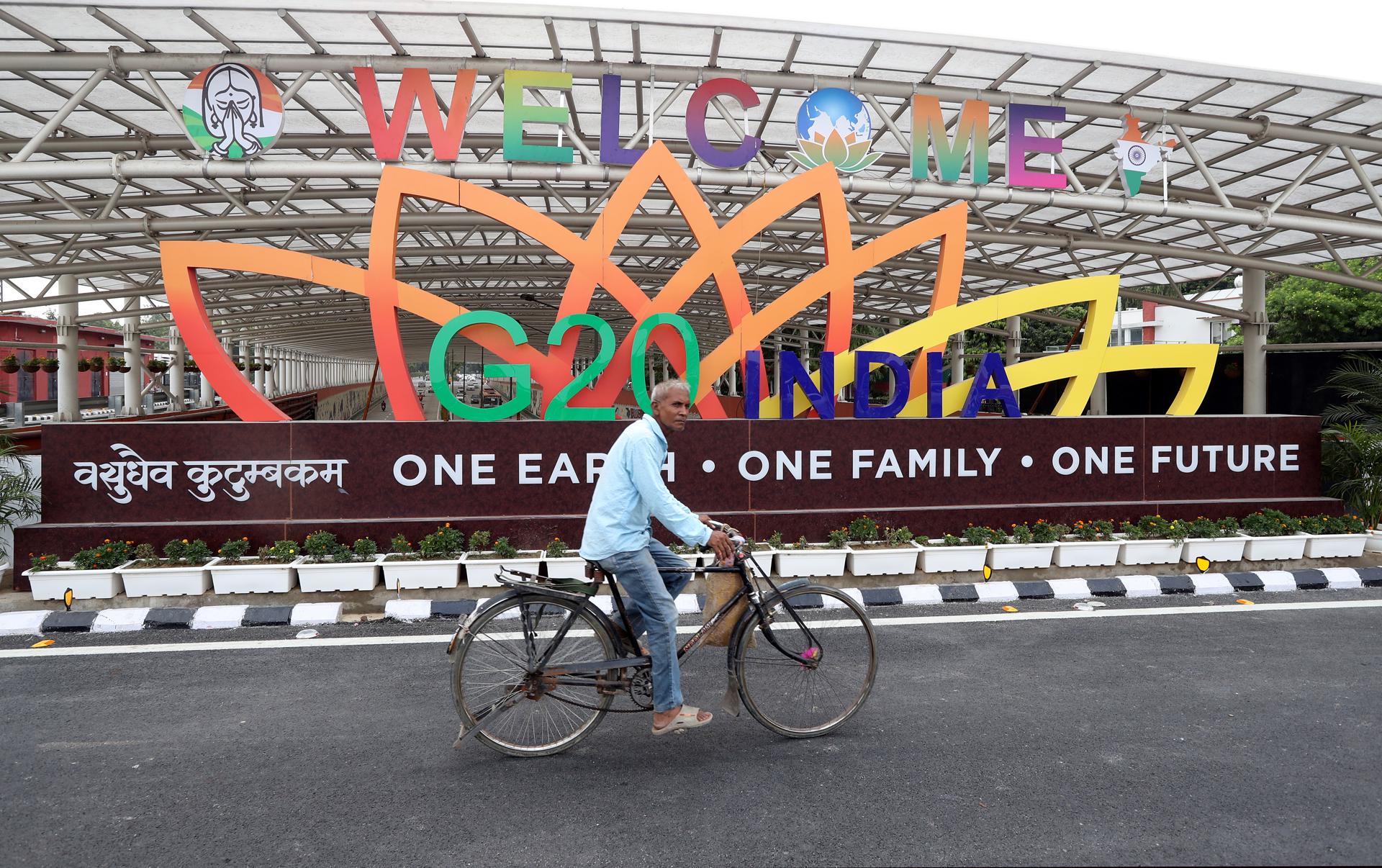 Locals pass by the G20 logo near the Bharat Mandapam at ITPO Convention Centre, Pragati Maidan, the venue of the G20 Heads of State and Government Summit in New Delhi, India, 31 August 2023. EFE-EPA/HARISH TYAGI