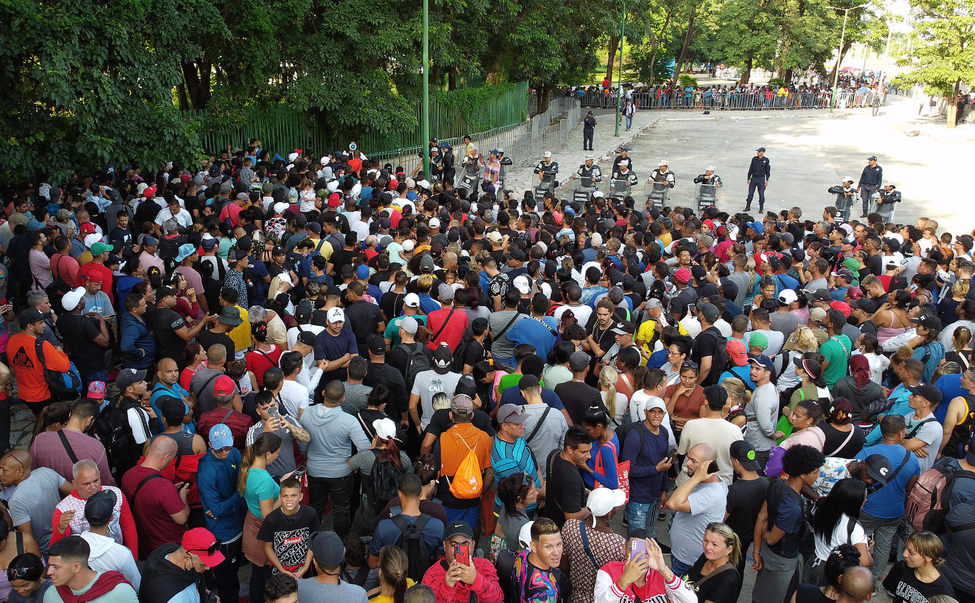MEX6370. TAPACHULA (MEXICO), 09/25/2023.- Aerial photograph of groups of migrants as they line up to process immigration papers at the Mexican Commission for Refugee Aid (Comar) today, in Tapachula, Chiapas (Mexico). EFE/Juan Manuel Blanco