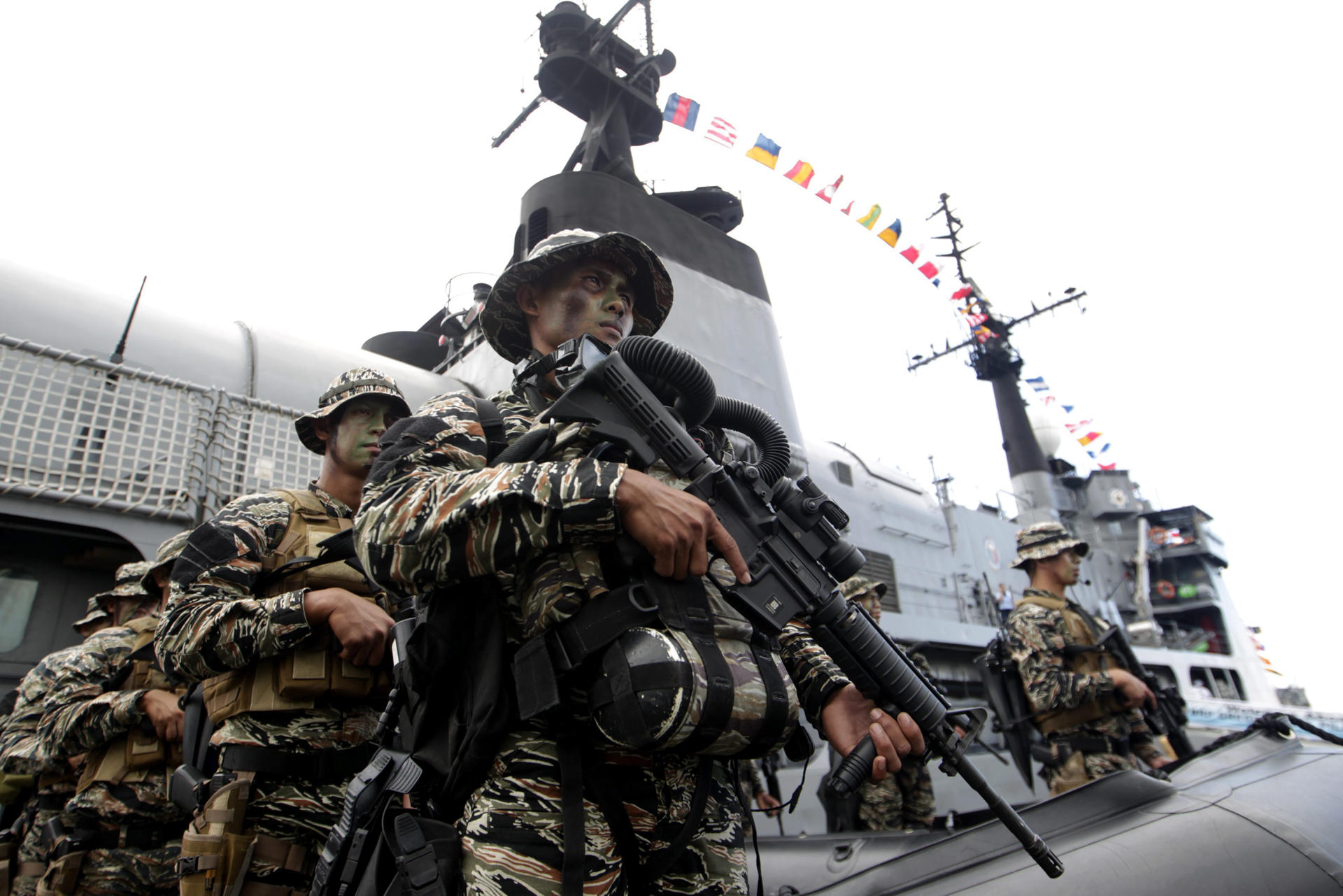 Filipino Navy Seals stand guard outside the Navy ship BRP Gregorio del Pilar (PF-15) during the Philippine Navy showcase of new and upcoming assets at the port in Manila, Philippines, 17 December 2014. EPA/RITCHIE B. TONGO/FILE