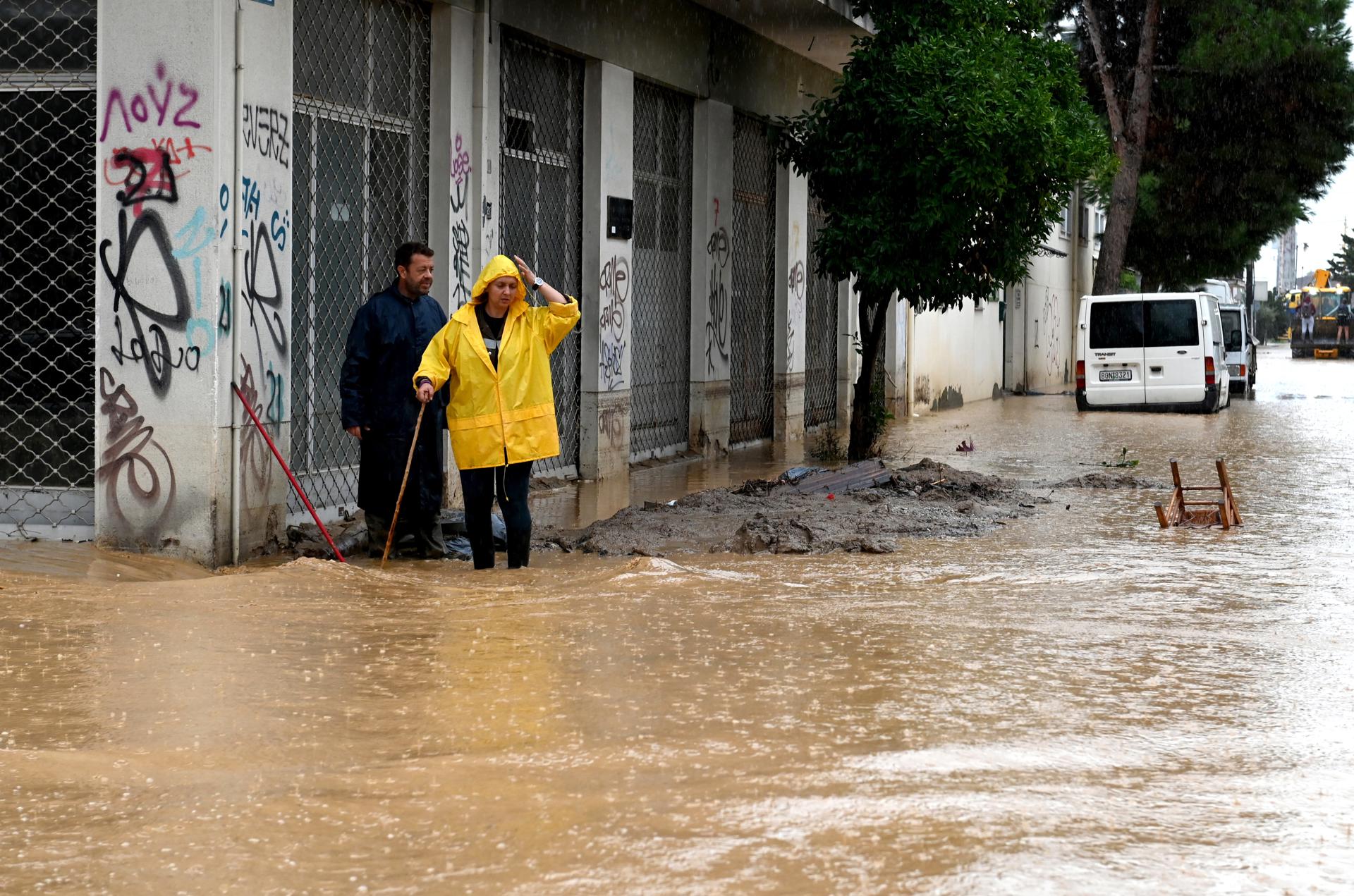Civilians try to cross the flooded road after the storm named Daniel, in the area of Volos, Magnesia, Greece, 07 September 2023. EFE/EPA/HATZIPOLITIS NICOLAOS