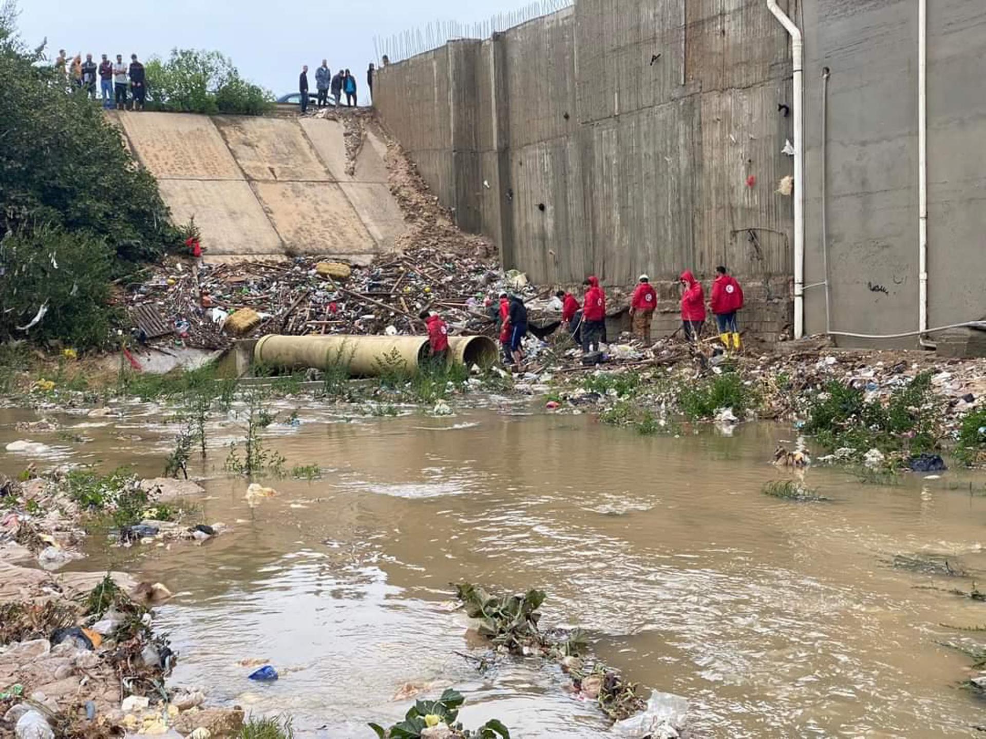 A handout photo made available by the Libyan Red Crescent shows members of the organization working to open roads in flooded areas at an undefined location in eastern Libya, 11 August 2023 (issued 13 September 2023). EFE/EPA/HANDOUT HANDOUT EDITORIAL USE ONLY/NO SALES