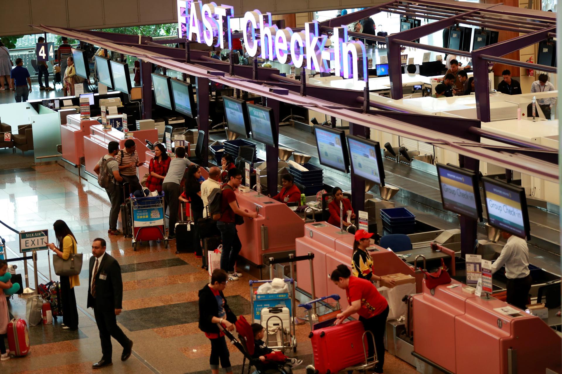 A file picture showing a general view of check-in counters at the departure hall of Terminal 2 in Changi Airport, Singapore. EPA/EFE/FILE/HOW HWEE YOUNG