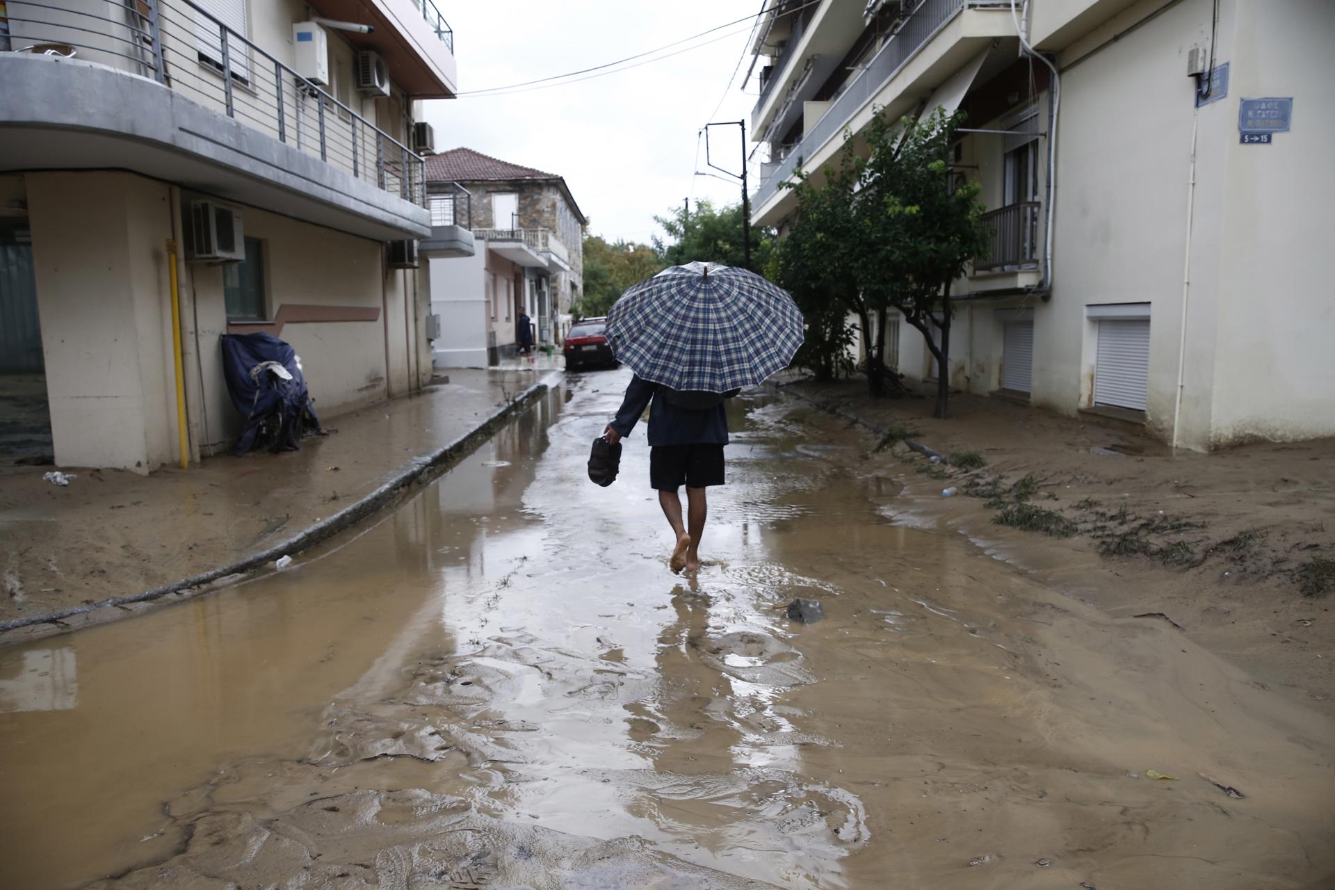 A man walks through a flooded road during the storm named Daniel in the area of Volos, Magnesia, Greece, 06 September 2023. EFE/EPA/YANNIS KOLESIDIS
