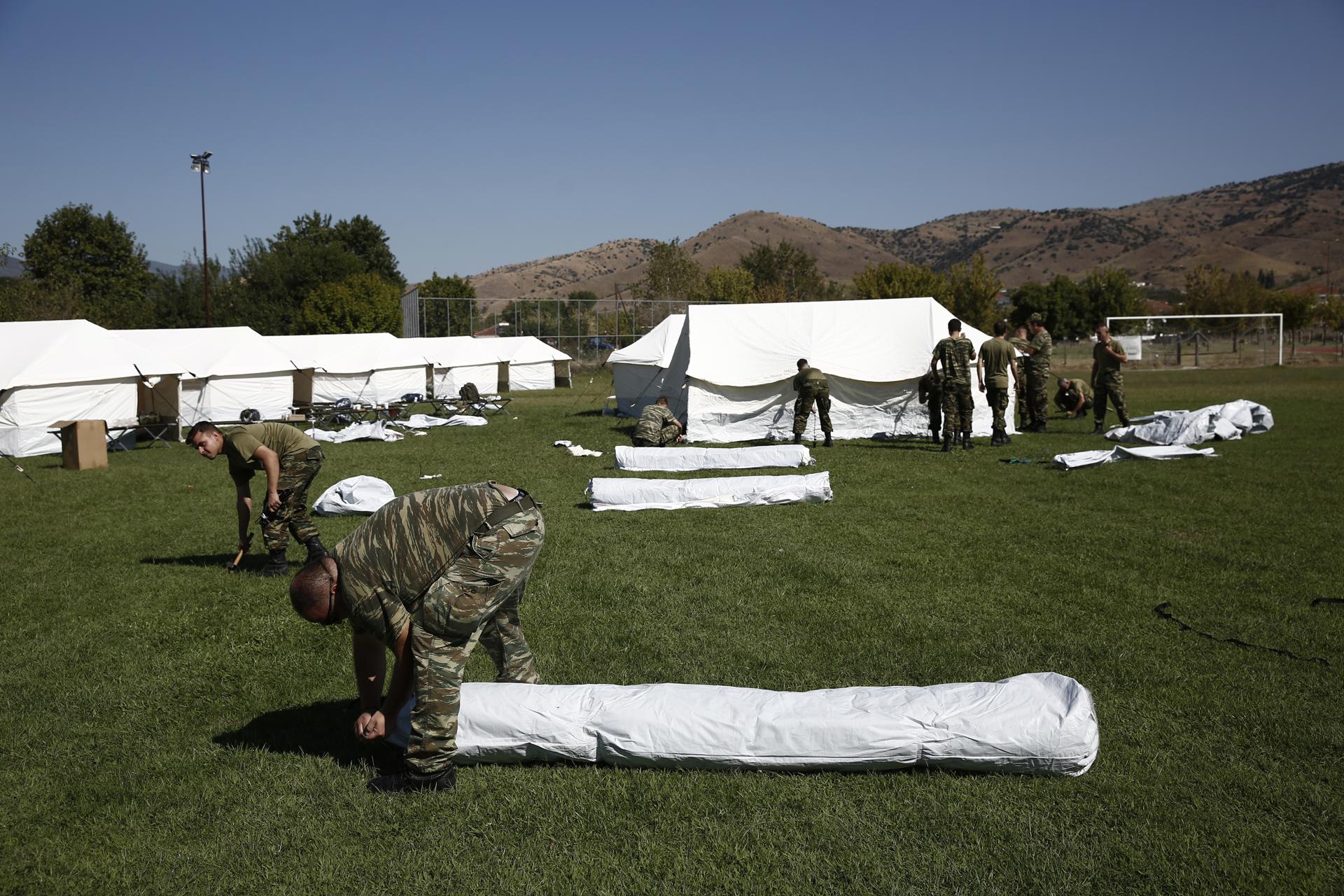 Soldiers set up tents for flood-affected people in the area of Grizano after storm 'Daniel' swept across Trikala, Greece, 10 September 2023. EFE/EPA/YANNIS KOLESIDIS
