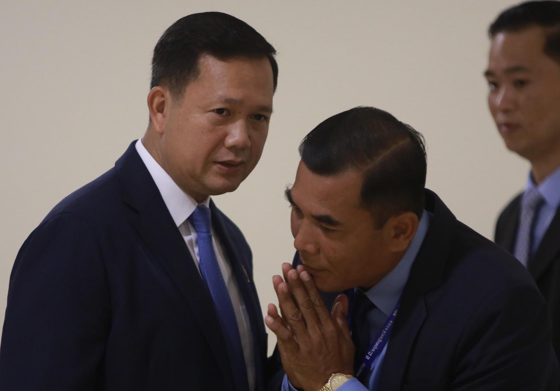Hun Manet (L), prime minister-designate and son of Cambodian Prime Minister Hun Sen, also army chief, arrives at the National Assembly during a plenary session in Phnom Penh, Cambodia, 22 August 2023. EFE-EPA FILE/KITH SEREY
