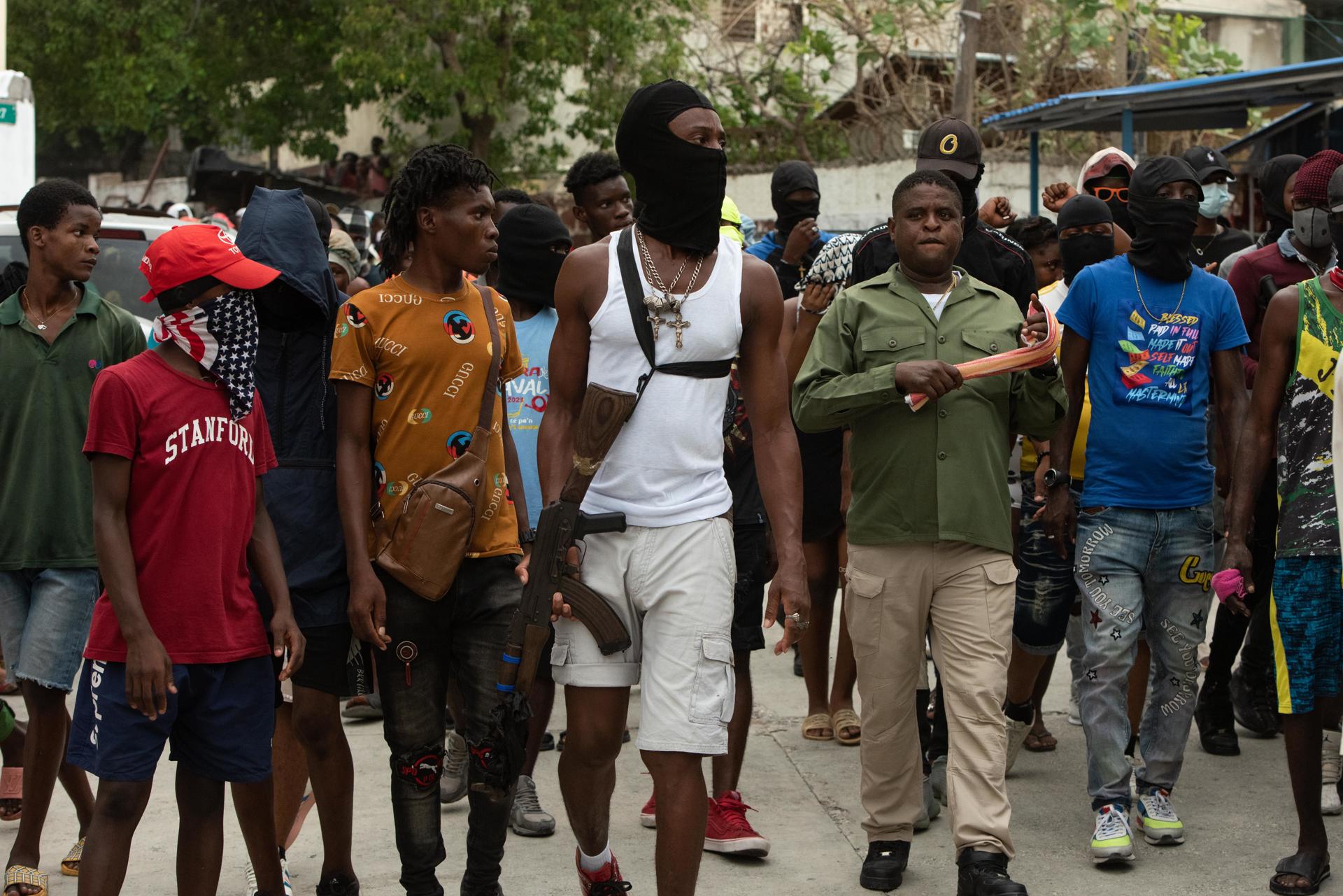Members of armed groups are seen guarding the street in Port-au-Prince, Haiti, 19 September 2023. EFE/ Johnson Sabin