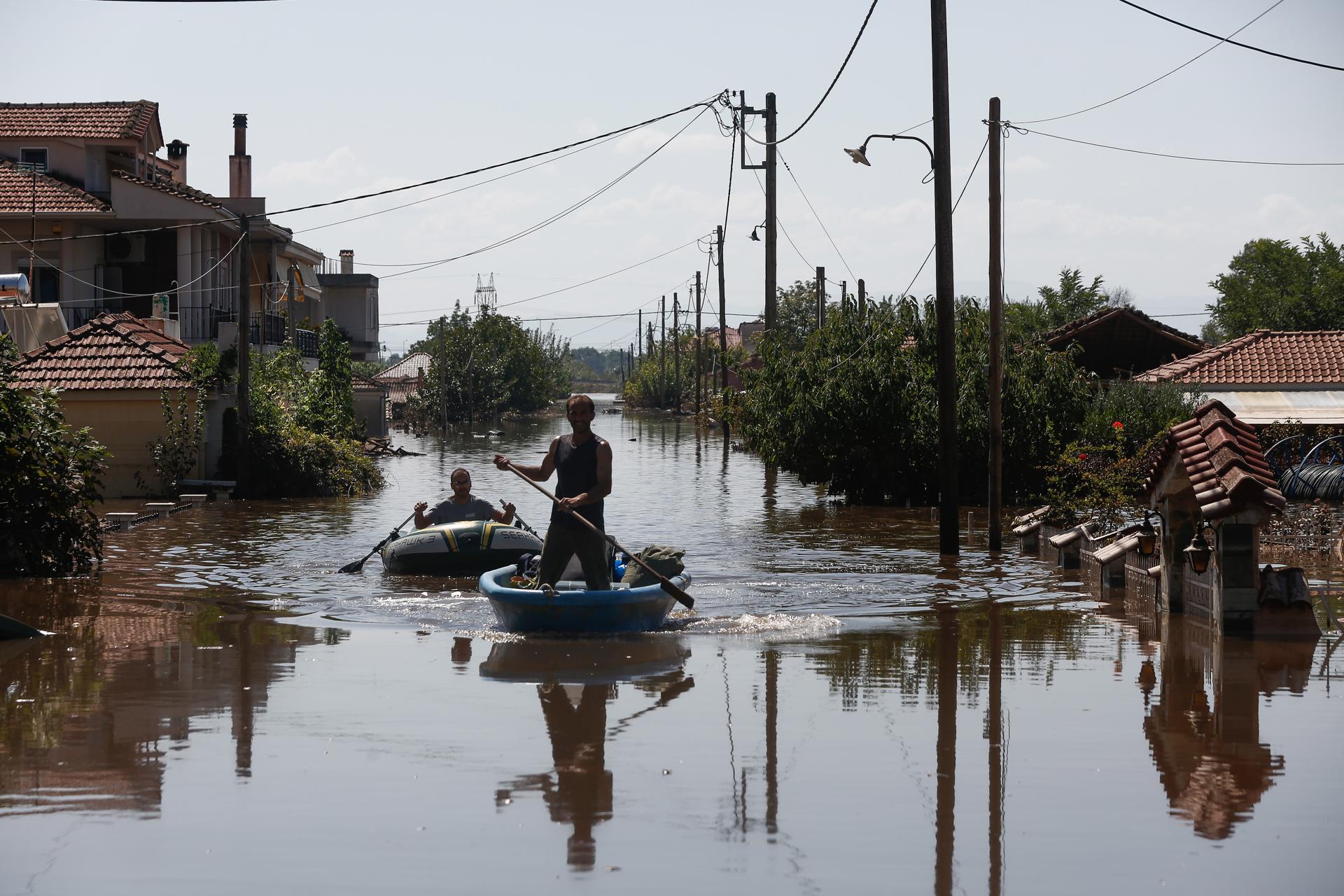 Volunteers with boats help flood-affected people after storm 'Daniel' swept across Trikala, Greece, 10 September 2023. EFE/EPA/YANNIS KOLESIDIS
