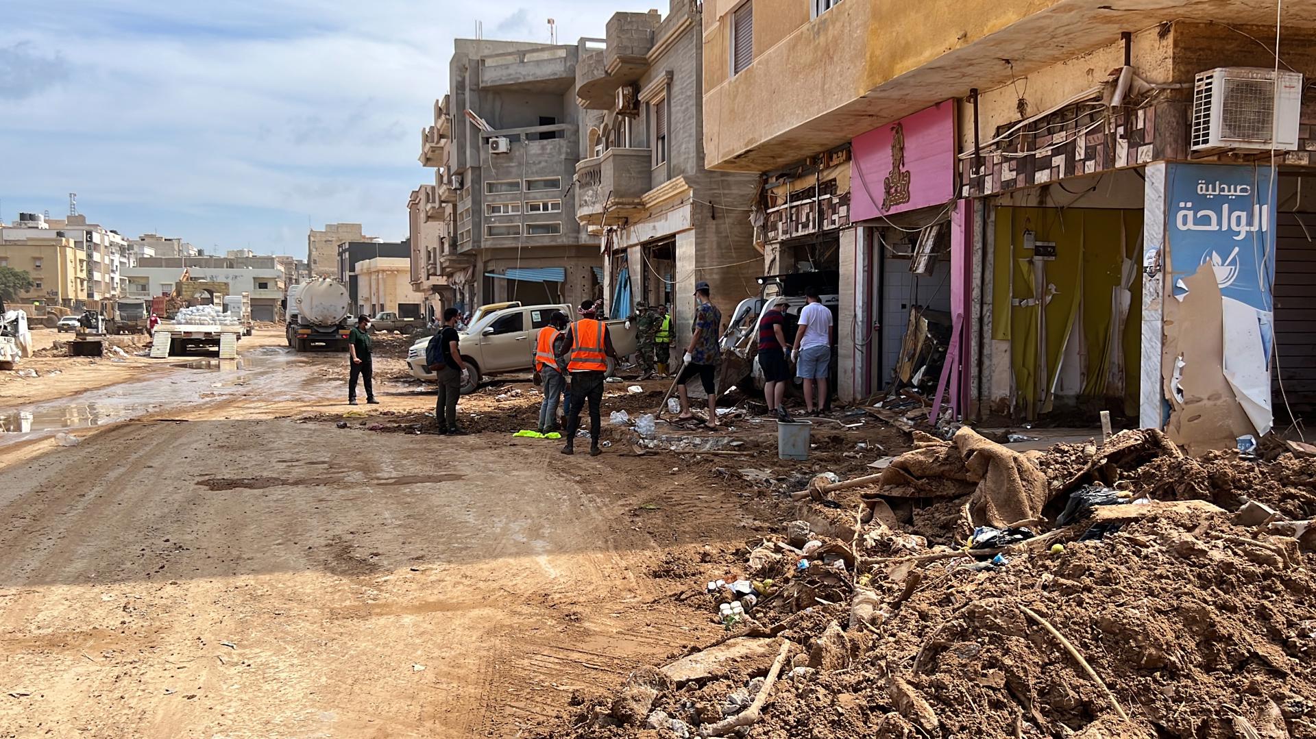 Citizens clear a road from mud after Storm Daniel swept across eastern Libya, in the port city of Derna, eastern Libya, 17 September 2023. EFE/EPA/STR