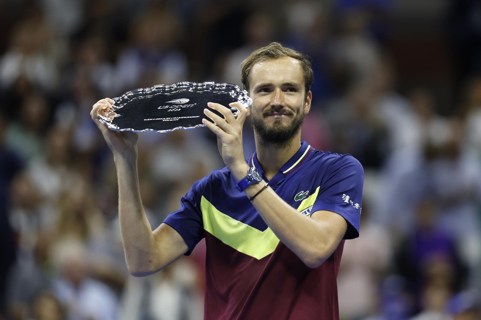 Daniil Medvedev of Russia brandishes his runner-up trophy after he was defeated by Novak Djokovic of Serbia against in their Men's Final match at the US Open Tennis Championships at the Flushing Meadows, New York, USA, 10 September 2023. EFE/EPA/JUSTIN LANE
