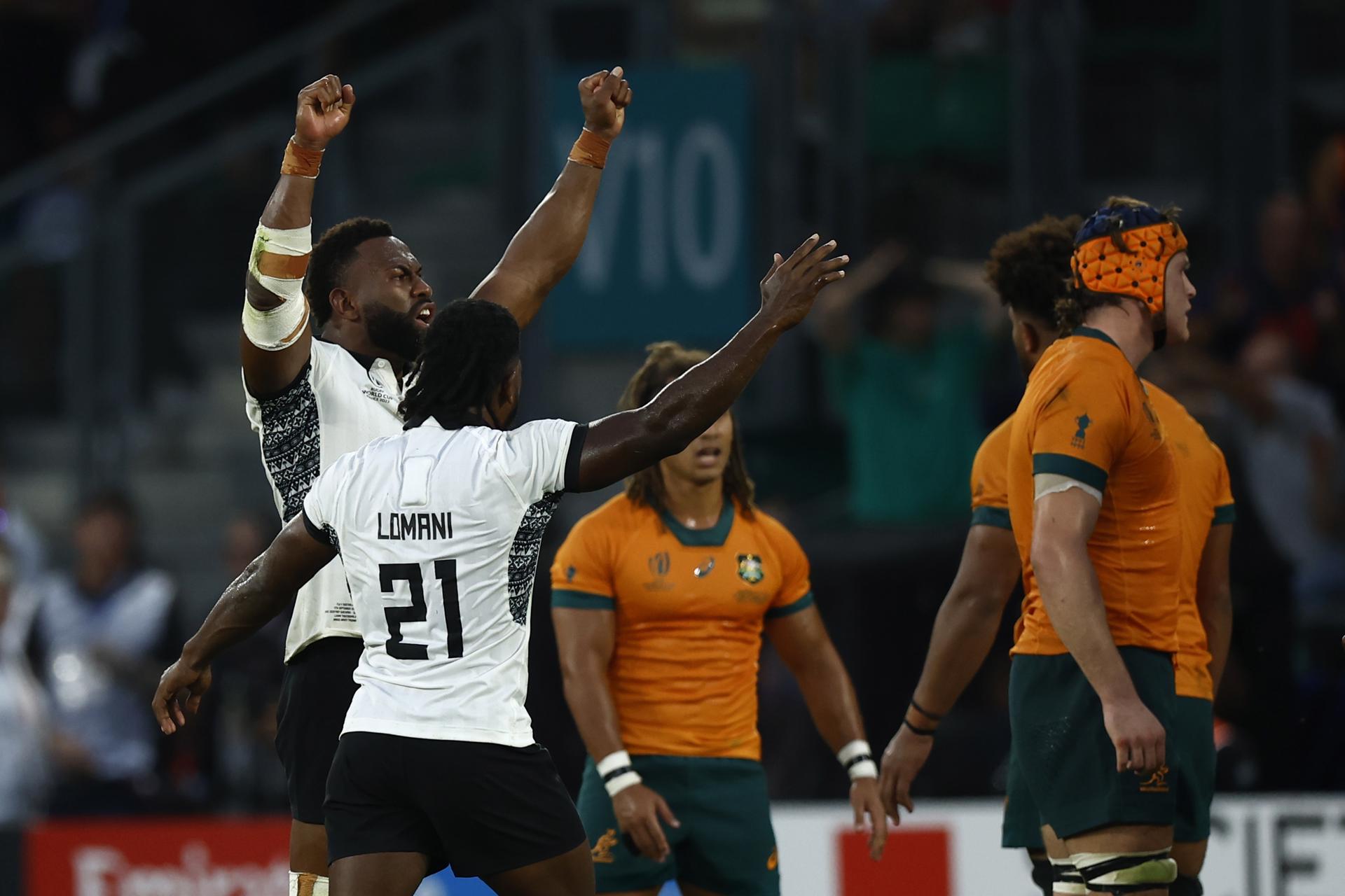 Fiji's Frank Lomani (C) and teammates celebrate after winning the Rugby World Cup Pool C match between Australia and Fiji in Saint-Etienne, France, 17 September 2023. EFE-EPA/YOAN VALAT
