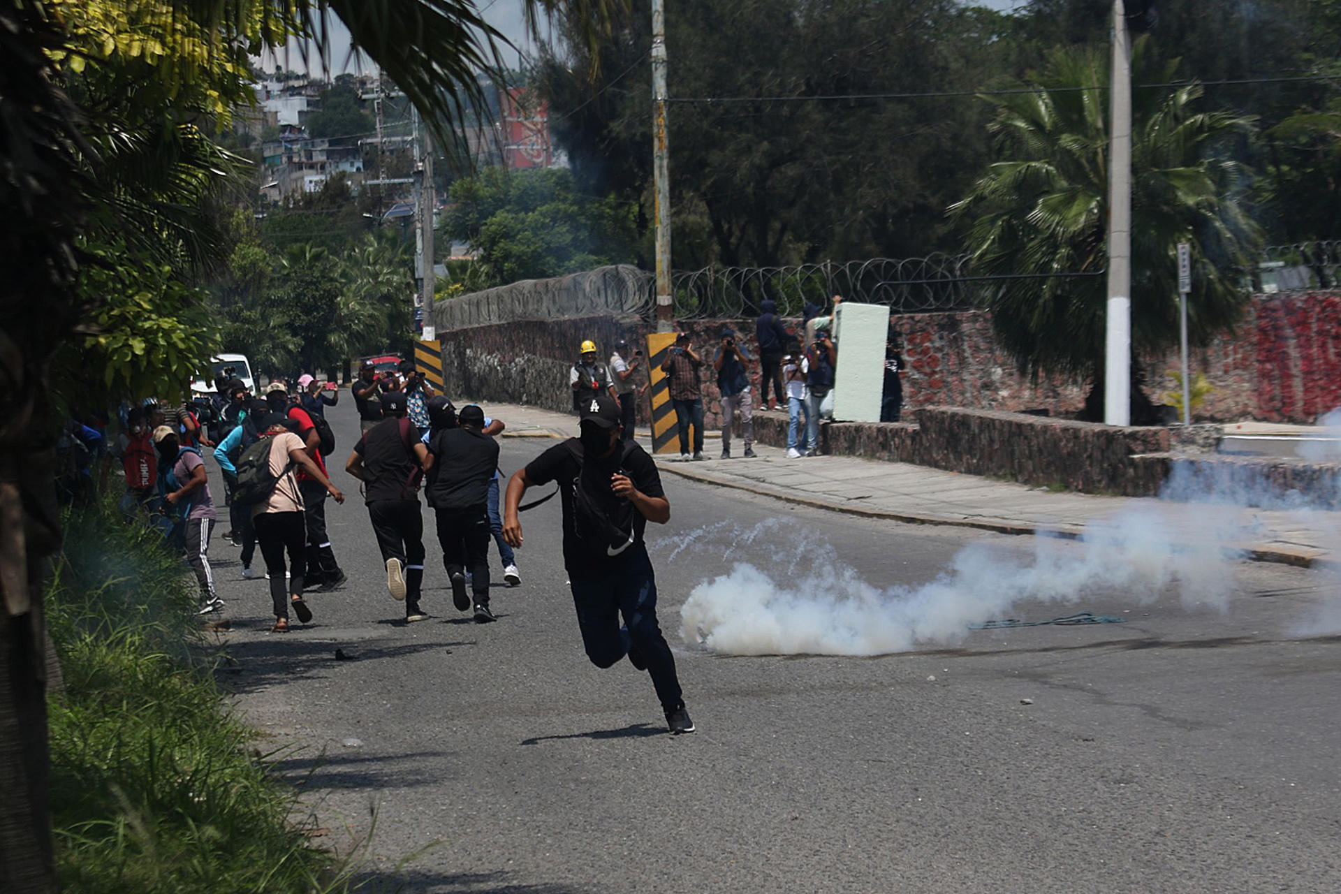 Students clash with National Guard's riot officers during protests in front of a military barracks to demand justice for the 43 missing students from Ayotzinapa, in Chilpancingo, state of Guerrero, Mexico, 14 September 2023. EFE/José Luis de la Cruz

