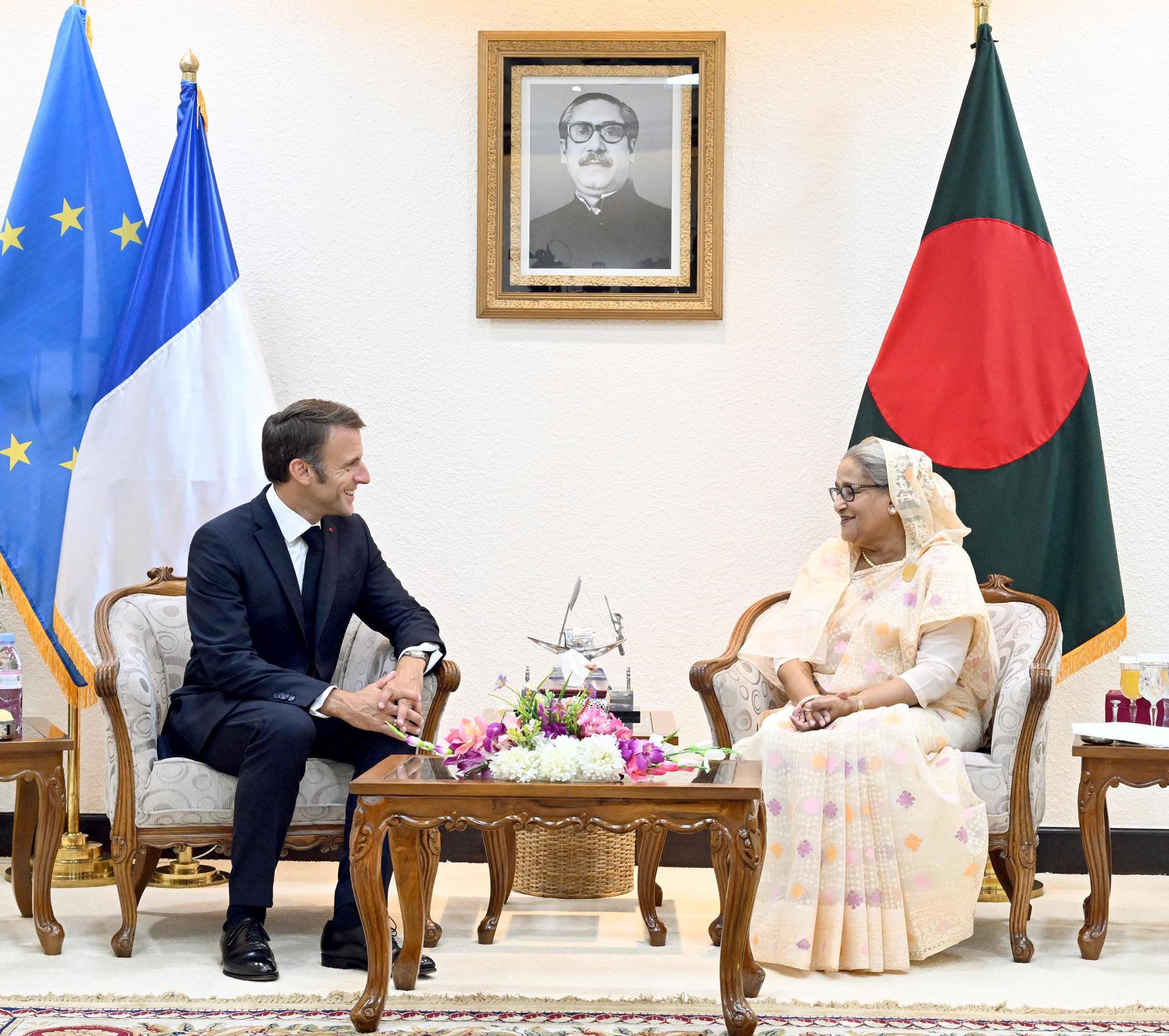 A handout picture made available by Bangladesh Prime Minister'Äôs office shows France President Emmanuel Macron (L) and Bangladesh Prime Minister Sheikh Hasina during a bilateral meeting in Dhaka, Bangladesh 11 September 2023. HANDOUT EDITORIAL USE ONLY/NO SALES