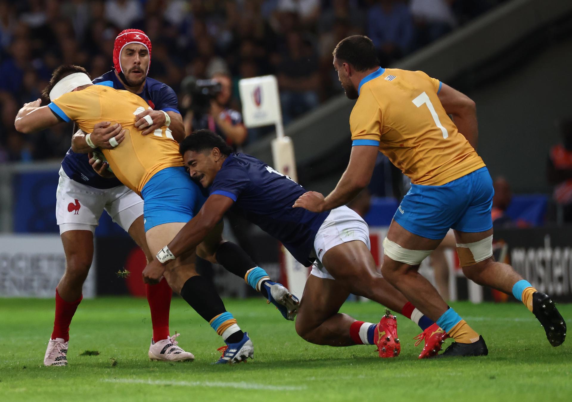 Uruguay's Andres Vilaseca (R) and France's Damien Penaud (L) in action during the Rugby World Cup Pool A match between France and Uruguay, in Lille, France, 14 September 2023. EFE-EPA/MOHAMMED BADRA
