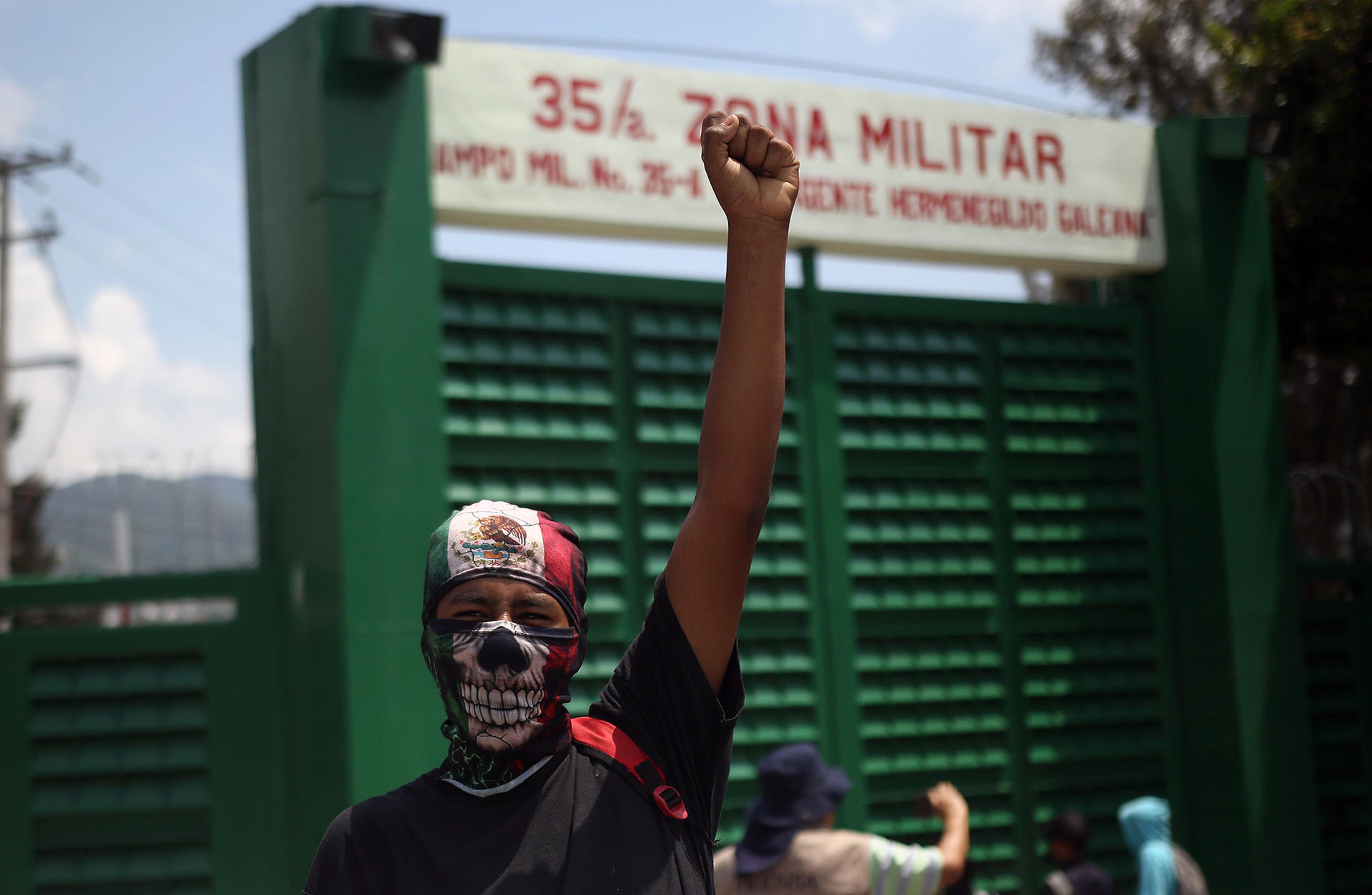 A students raises his fist during protests in front of a military barracks to demand justice for the 43 missing students from Ayotzinapa, in Chilpancingo, state of Guerrero, Mexico, 14 September 2023. EFE/José Luis de la Cruz
