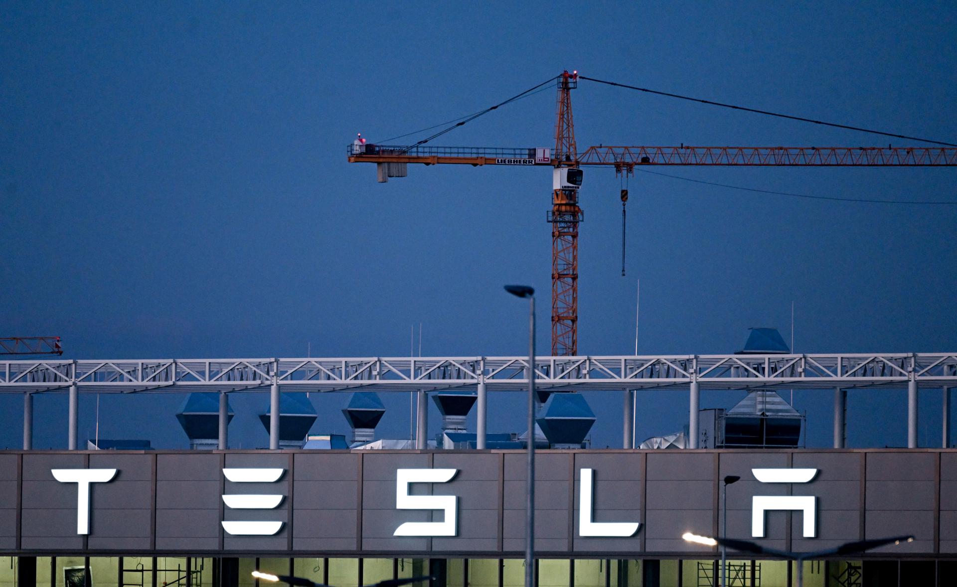 The Tesla logo is displayed on an exterior wall of the Tesla Gigafactory in Gruenheide near Berlin, Germany, 03 January 2023. EFE/EPA/Filip Singer