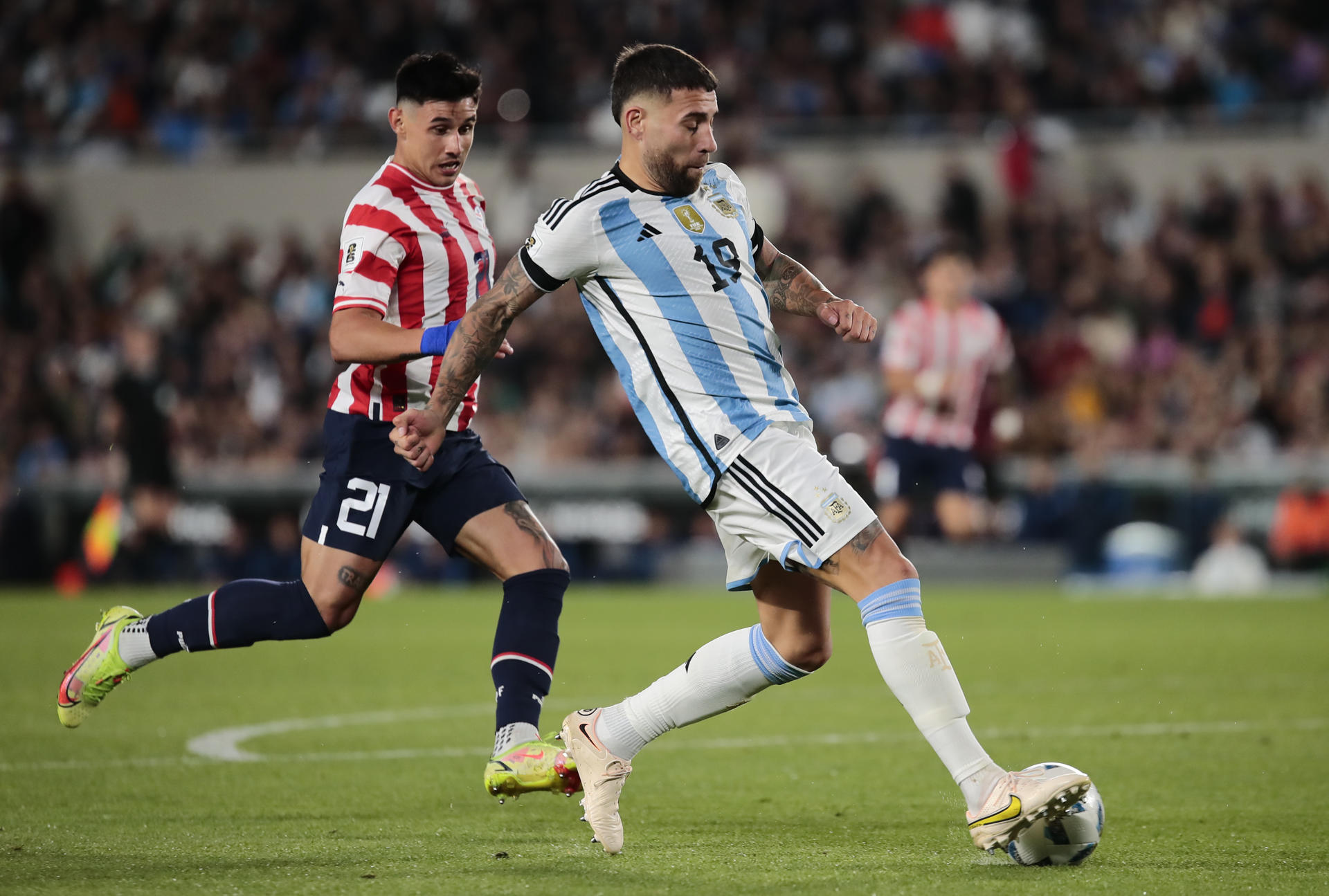 Nicolas Otamendi (r) from Argentina disputes the ball with Adam Bareiro (L) from Paraguay, in a match of the South American Qualifiers for the 2026 Soccer World Cup between Argentina and Paraguay at the Mas Monumental stadium in Buenos Aires, Argentina 12 October 2023. EFE-EPA/Luciano Gonzalez