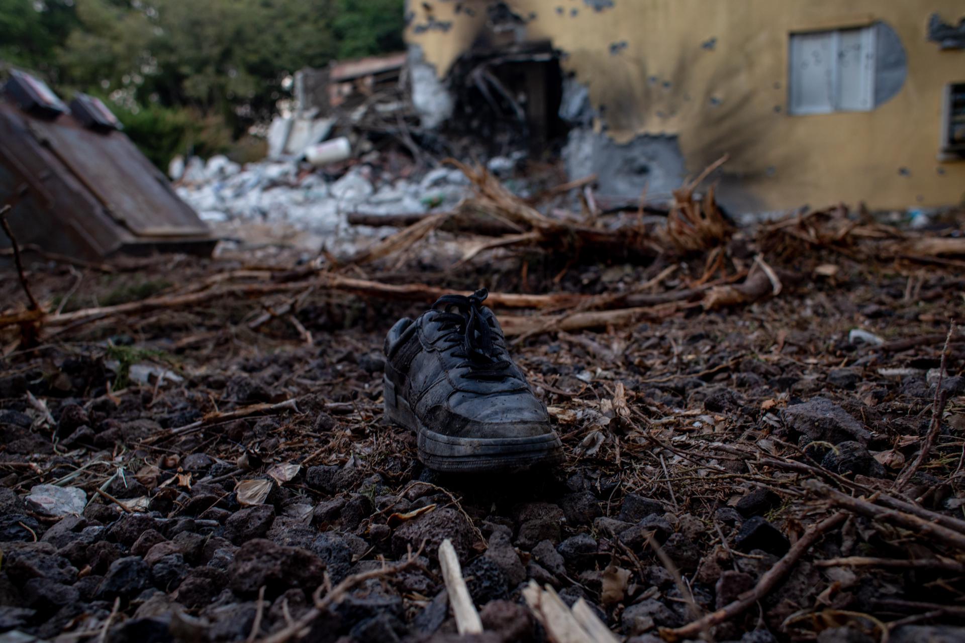 A boot lies on the ground outside a damaged house in the Be'eri kibbutz, near the Gaza border, Israel, 11 October 2023. EFE/EPA/MARTIN DIVISEK