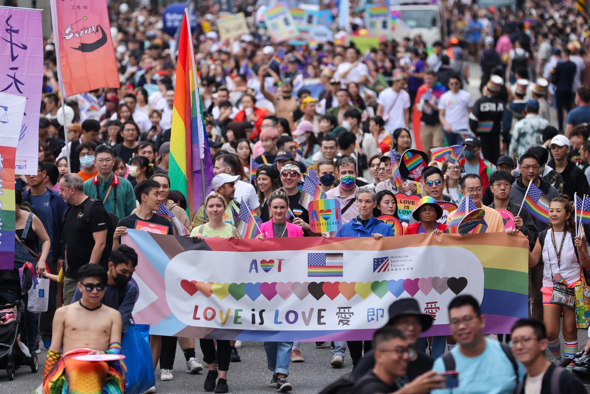 People march on a street during the annual Taiwan Pride parade in Taipei, Taiwan, 28 October 2023. EFE/EPA/RITCHIE B. TONGO