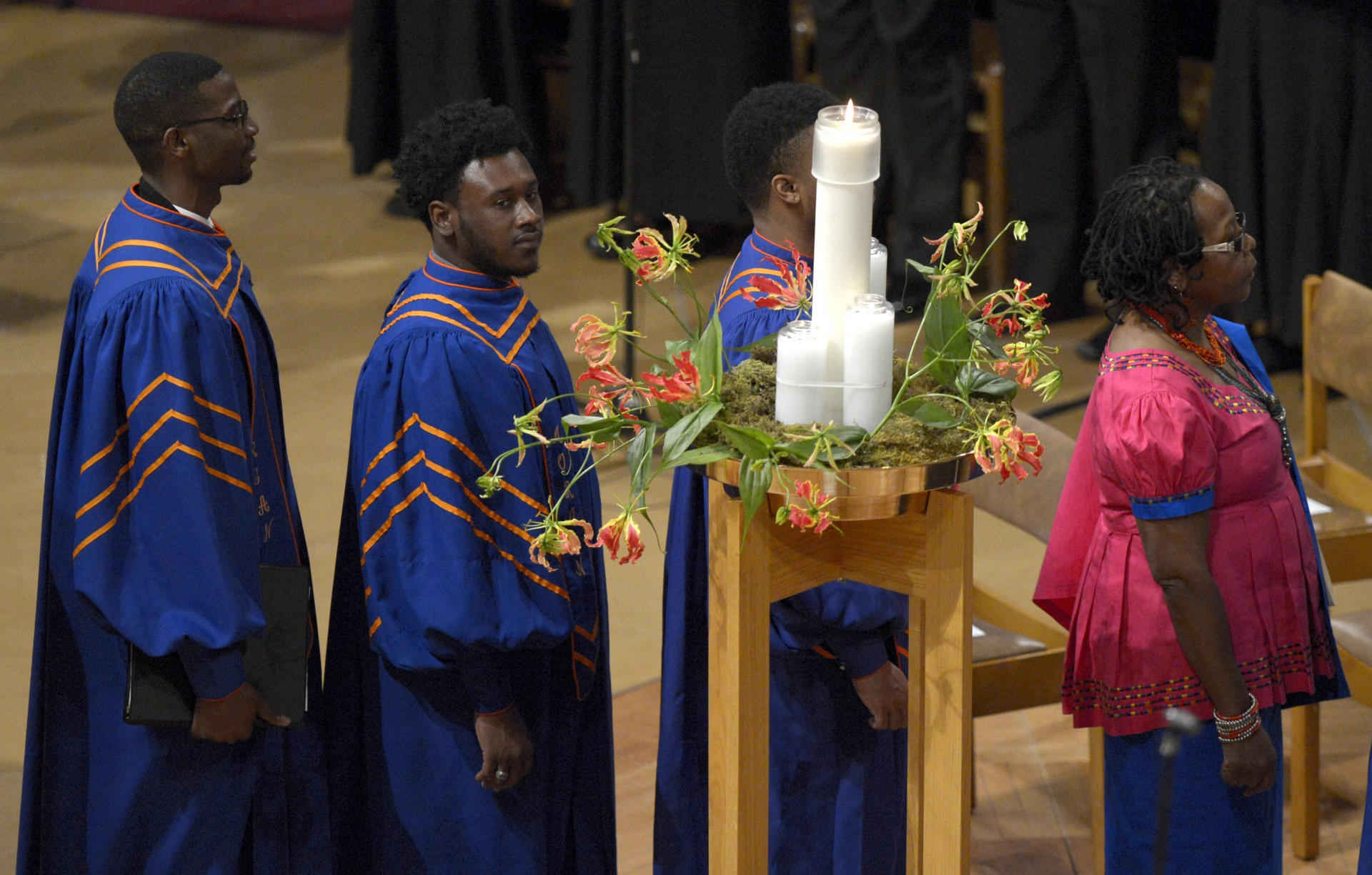 A file photo shows members of the Morgan State University Choir walk by the memorial candle during the National Memorial Service for the late South African President Nelson Mandela at the National Cathedral in Washington, DC, USA, 11 December 2013. EPA/FILE/SHAWN THEW