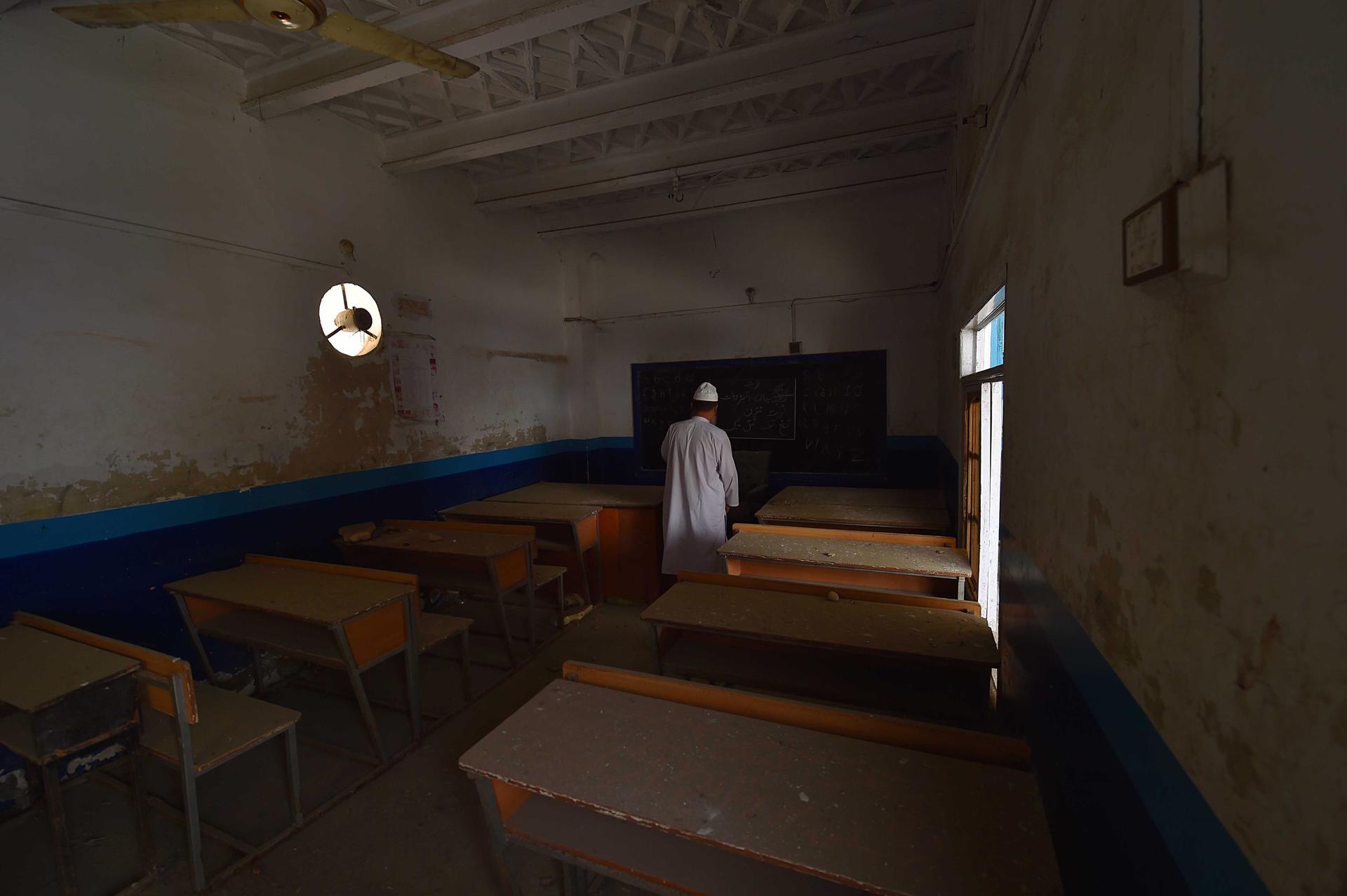 A staff of the Ghazi Amanullah Khan High School for Afghan refugees tours the school as it was closed due to shortage of funding, in Karachi, Pakistan, 26 September 2023 (issued 27 September 2023). EFE-EPA FILE/SHAHZAIB AKBER
