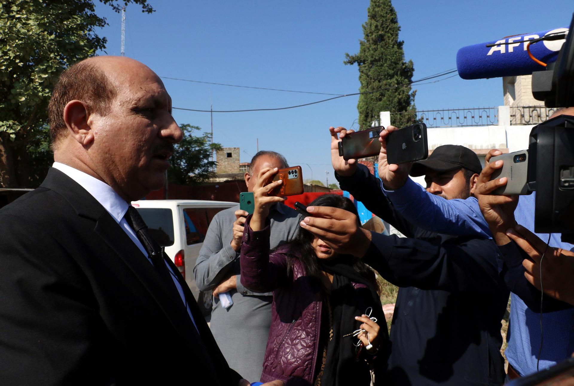 Shah Khawar, the Federal Investigation Agency (FIA) special prosecutor, talks with journalists after a case hearing of former Prime Minister and Pakistan Tehrik-e-Insaf (PTI) party chairman Imran Khan, outside the Adiyala Prison, where Khan is kept, in Rawalpindi, Pakistan, 23 October 2023. EFE-EPA/SOHAIL SHAHZAD
