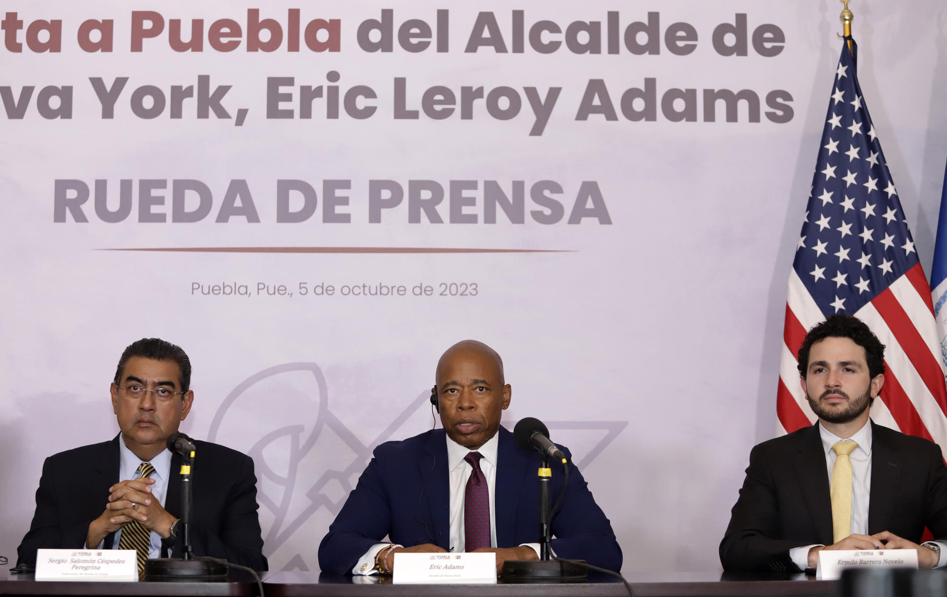 The governor of the state of Puebla, Sergio Salomón Céspedes (L), the mayor of New York, Eric Adams (C) and the state Secretary of Economy Ermilio Barrera (R) during a press conference in the city of Puebla, Mexico, 05 October 2023. EFE/Hilda Ríos
