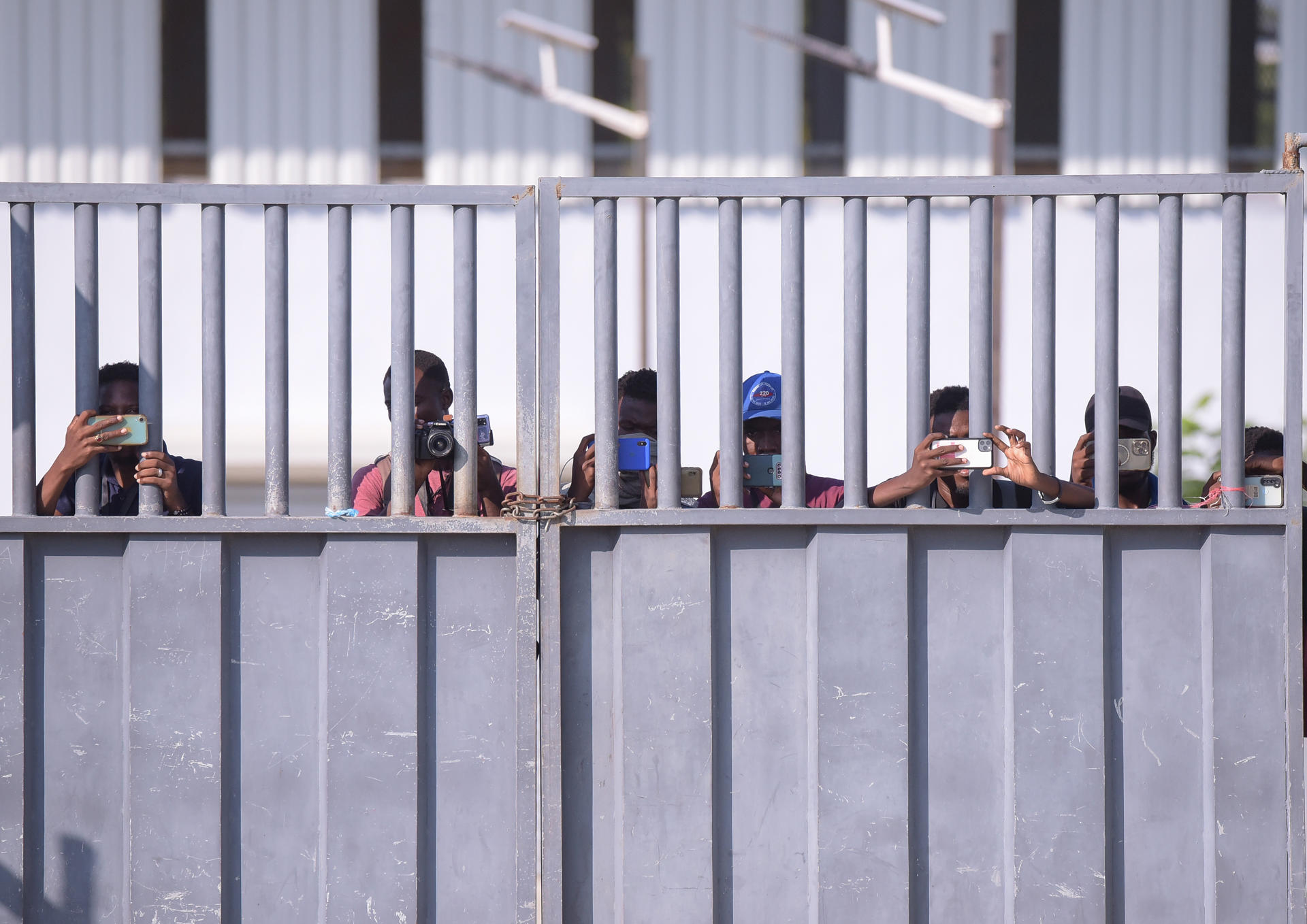 Members of the Haitian press record images from their side of the border on October 13, 2023, near the binational market, in Dajabón (Dominican Republic). EFE/Luis Tavárez