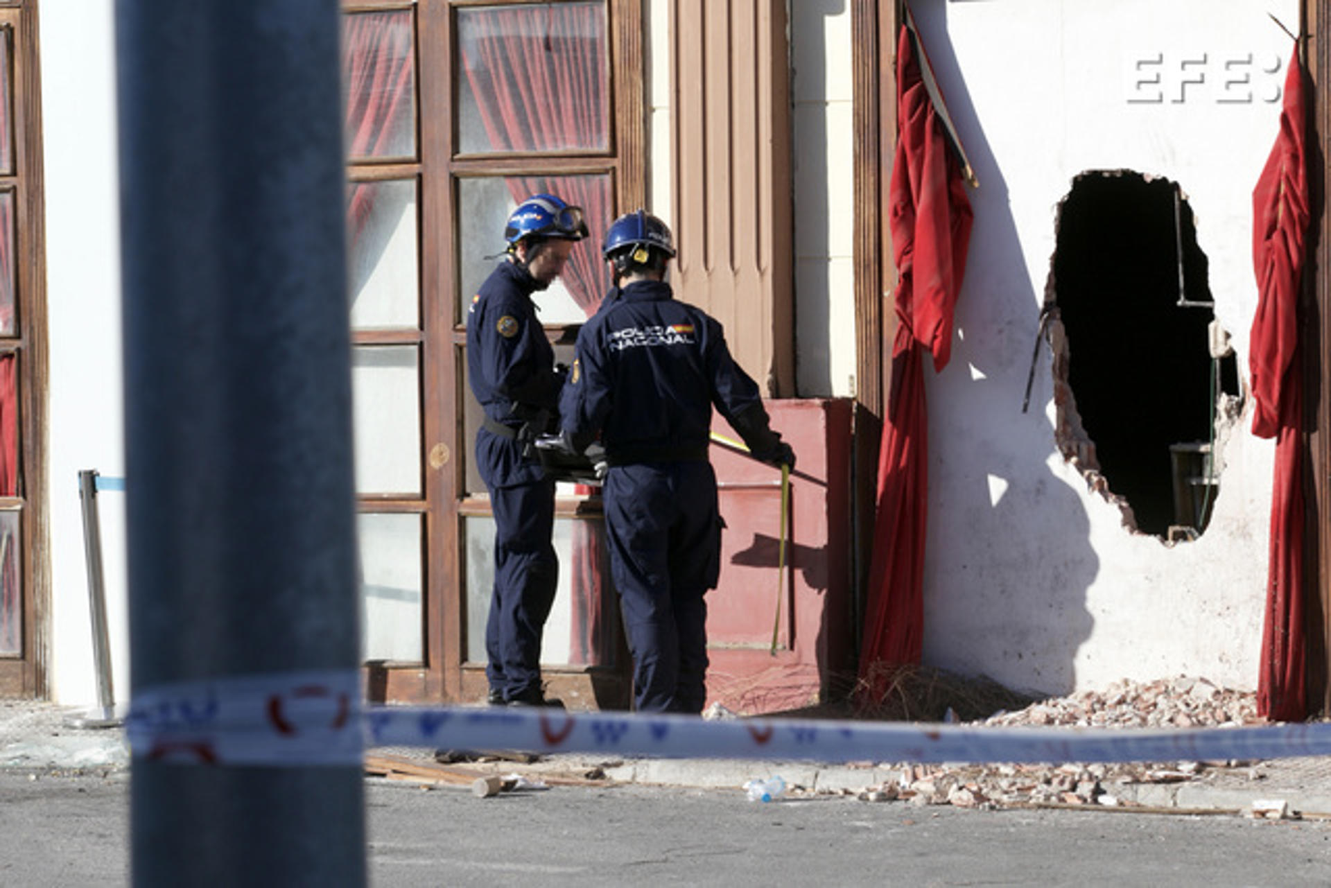 Judicial Police officers carry out an investigation at the premises of the Teatre and Fonda Milagros nightclubs in Murcia, south-eastern Spain, after the fire declared early on 01 October which cost the lives of thirteen people. EFE/Juan Carlos Caval
