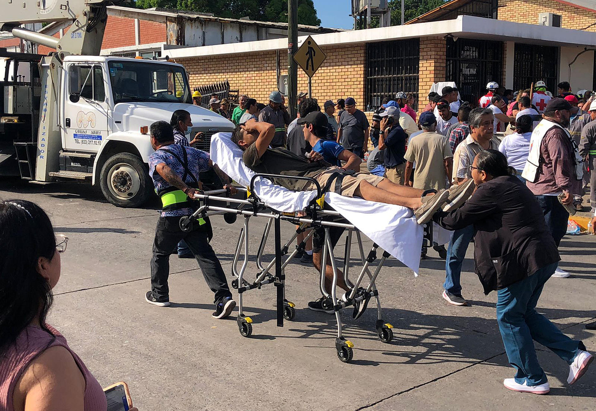 Rescue personnel treat people injured by the collapse of the roof of a church in Ciudad Madero, Tamaulipas, Mexico, on Oct. 1, 2023. EFE/STR
