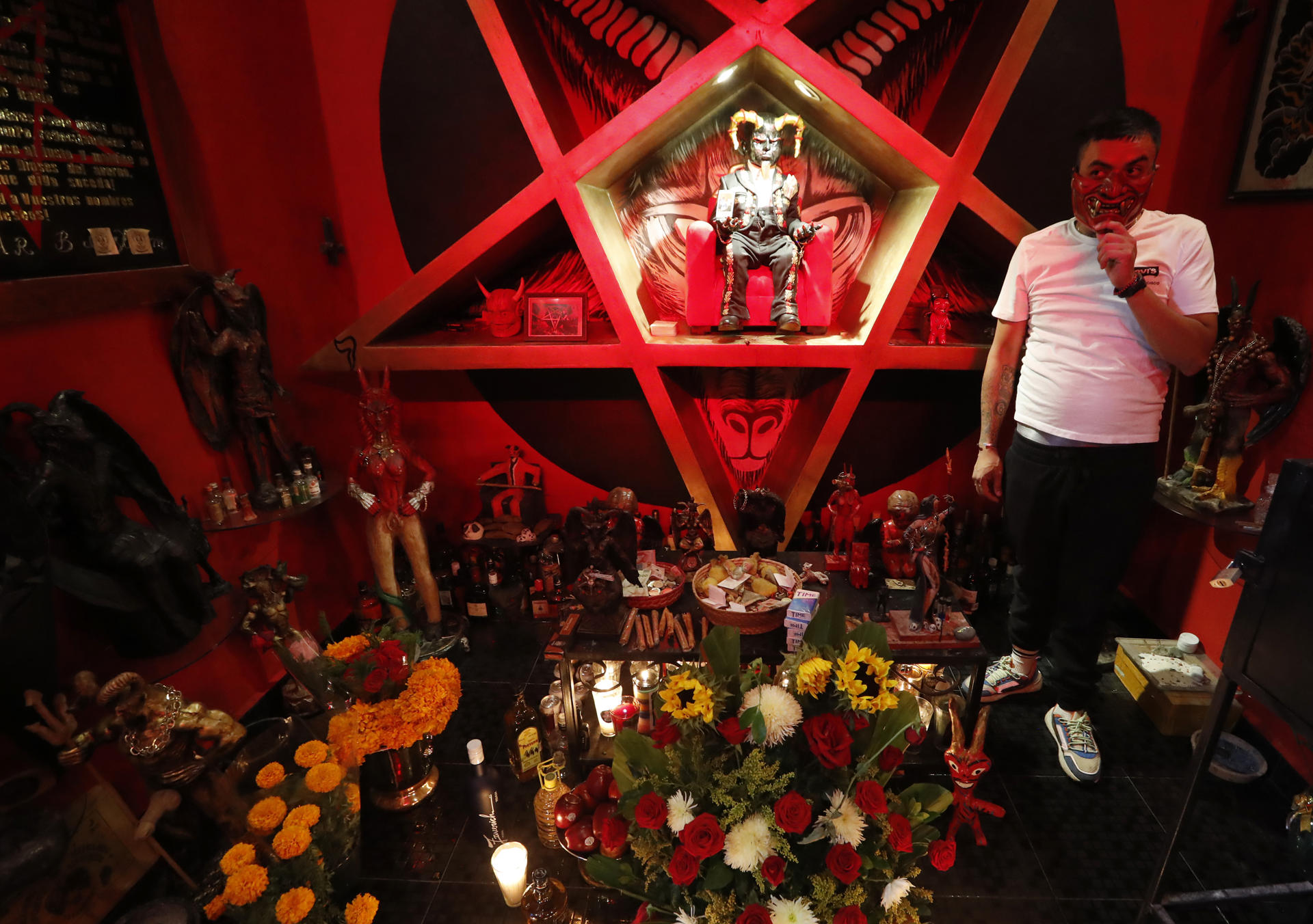 Alexis "El Chino", creator of the altar to "Angelito Negro" (black little angel), celebrates the 22nd anniversary of the altar of Santa Muete in the popular neighborhood of Tepito in Mexico City, Mexico, 31 October 2023. EFE/ Mario Guzman
