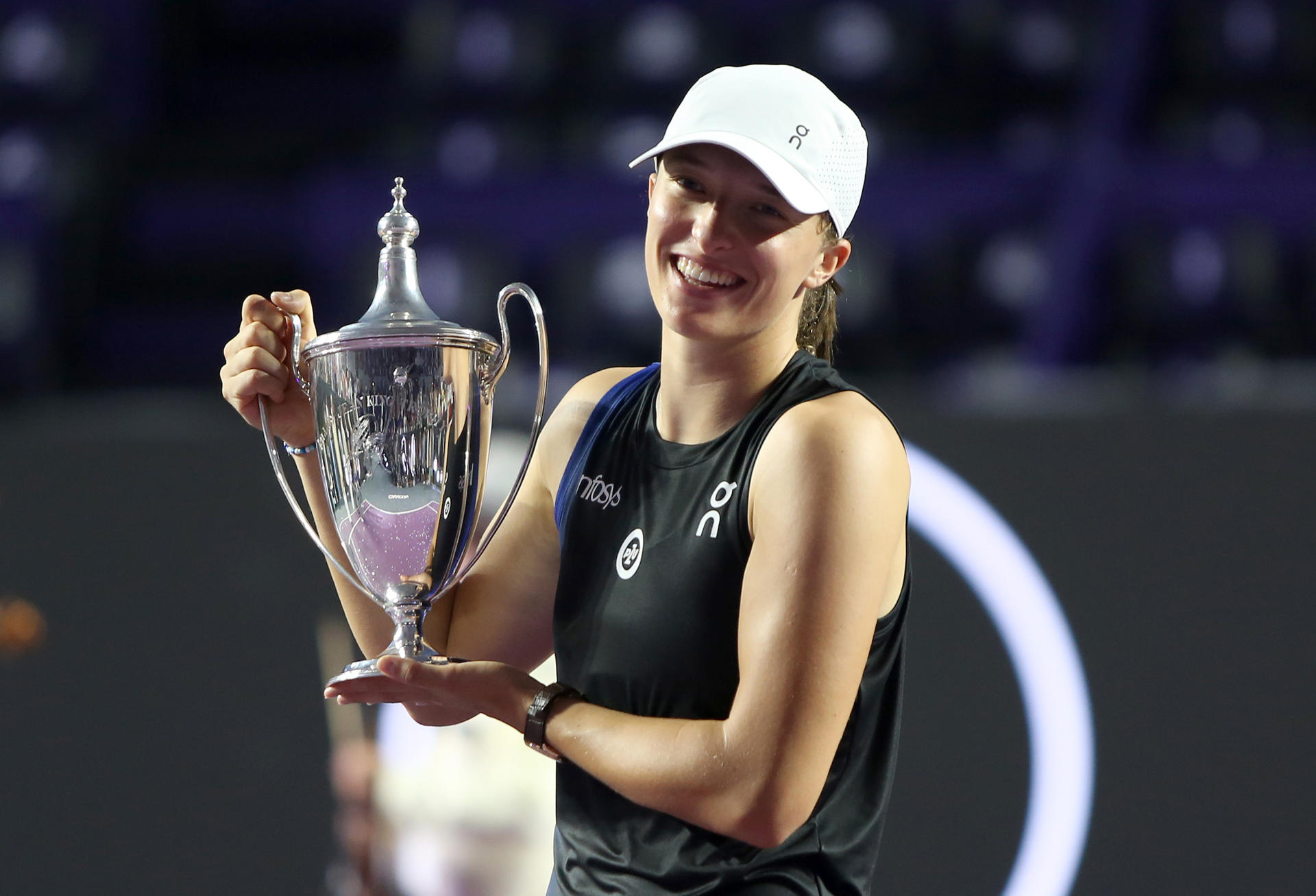 Polish tennis player Iga Natalia Swiatek celebrates with the trophy after winning the final of the WTA Finals Cancun women's tennis tournament against American Jessica Pegula, at the Paradisius hotel in Cancun, Mexico, 06 November 2023. EFE-EPA/Alonso Cupul