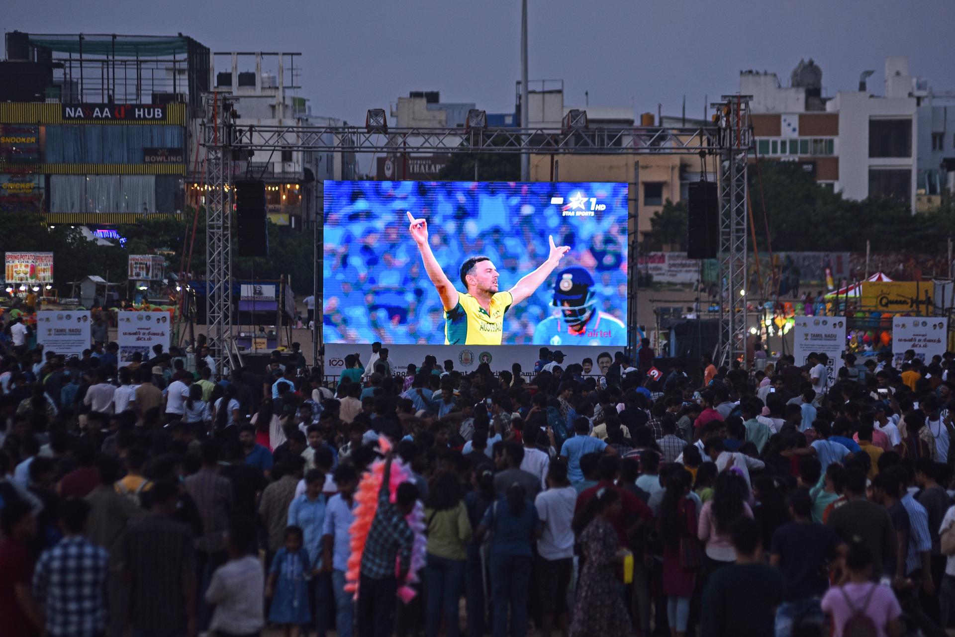 Indian cricket fans react as they watch the live telecast of the ICC Men's Cricket 2023 World Cup final match between India and Australia on a big screen, at Edward Elliot's Beach, in Chennai, India, 19 November 2023. EFE/EPA/IDREES MOHAMMED
