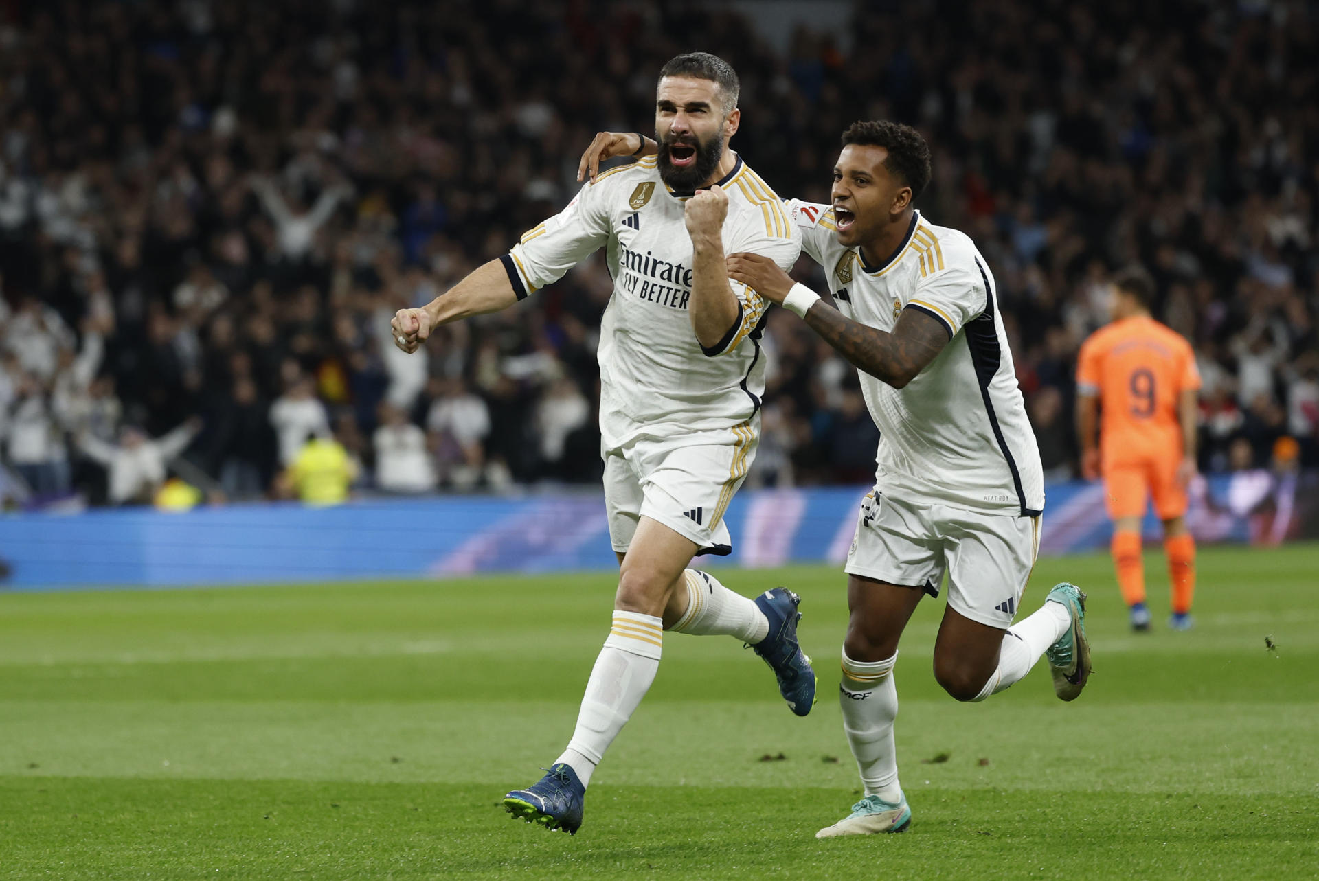 Real Madrid's defender Dani Carvajal (L) celebrates with teammate Rodrygo Goes (R) after scoring the 1-0 goal during the Spanish LaLiga soccer match between Real Madrid and Valencia CF, in Madrid, central Spain, 11 November 2023. EFE-EPA/Mariscal
