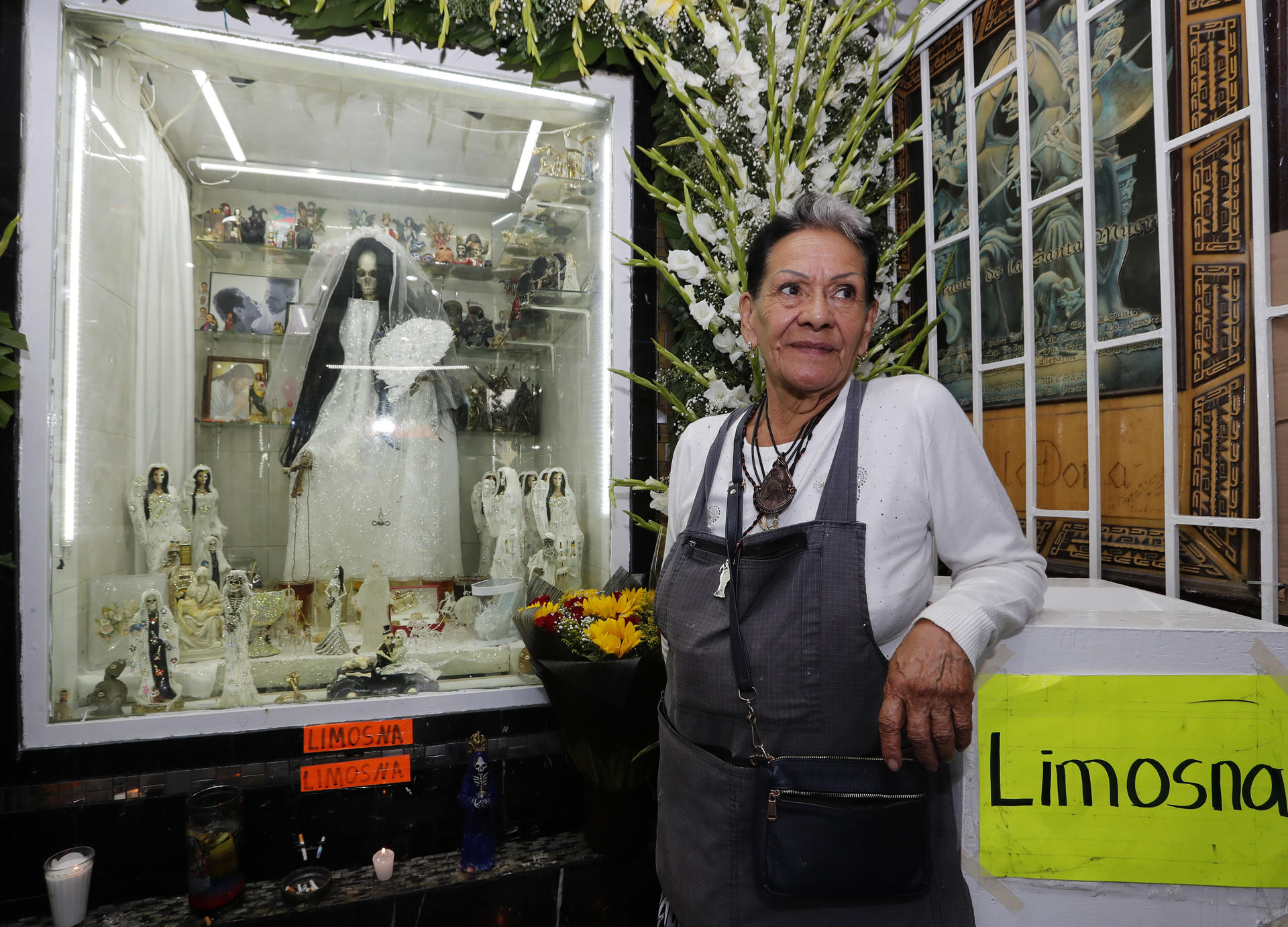 Mrs. Enriqueta Romero, "guardian" of Santa Muerte, poses during the 22nd anniversary of her altar in the popular neighborhood of Tepito, in Mexico City, Mexico, 31 October 2023. EFE/ Mario Guzman